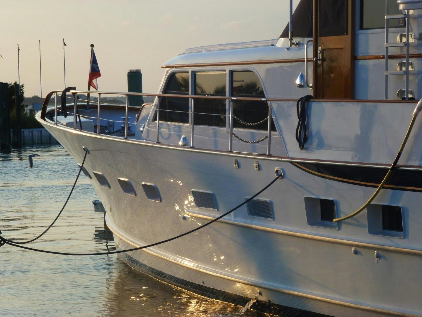 a boat parked on the water aboard Independence Yacht for Sale