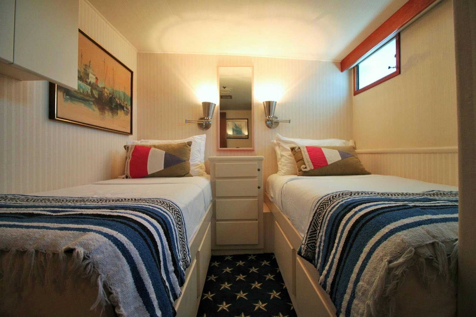 a couple of beds in a hotel room aboard Independence Yacht for Sale