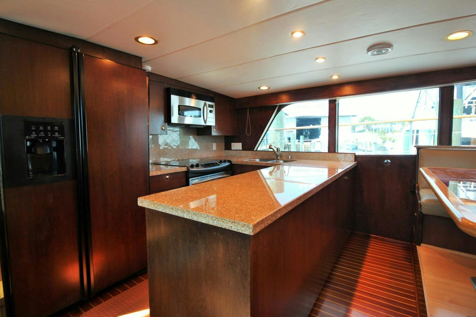a kitchen with a large island aboard Independence Yacht for Sale
