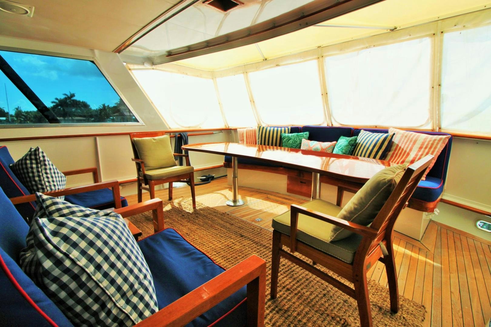 a tent with chairs and a table aboard Independence Yacht for Sale