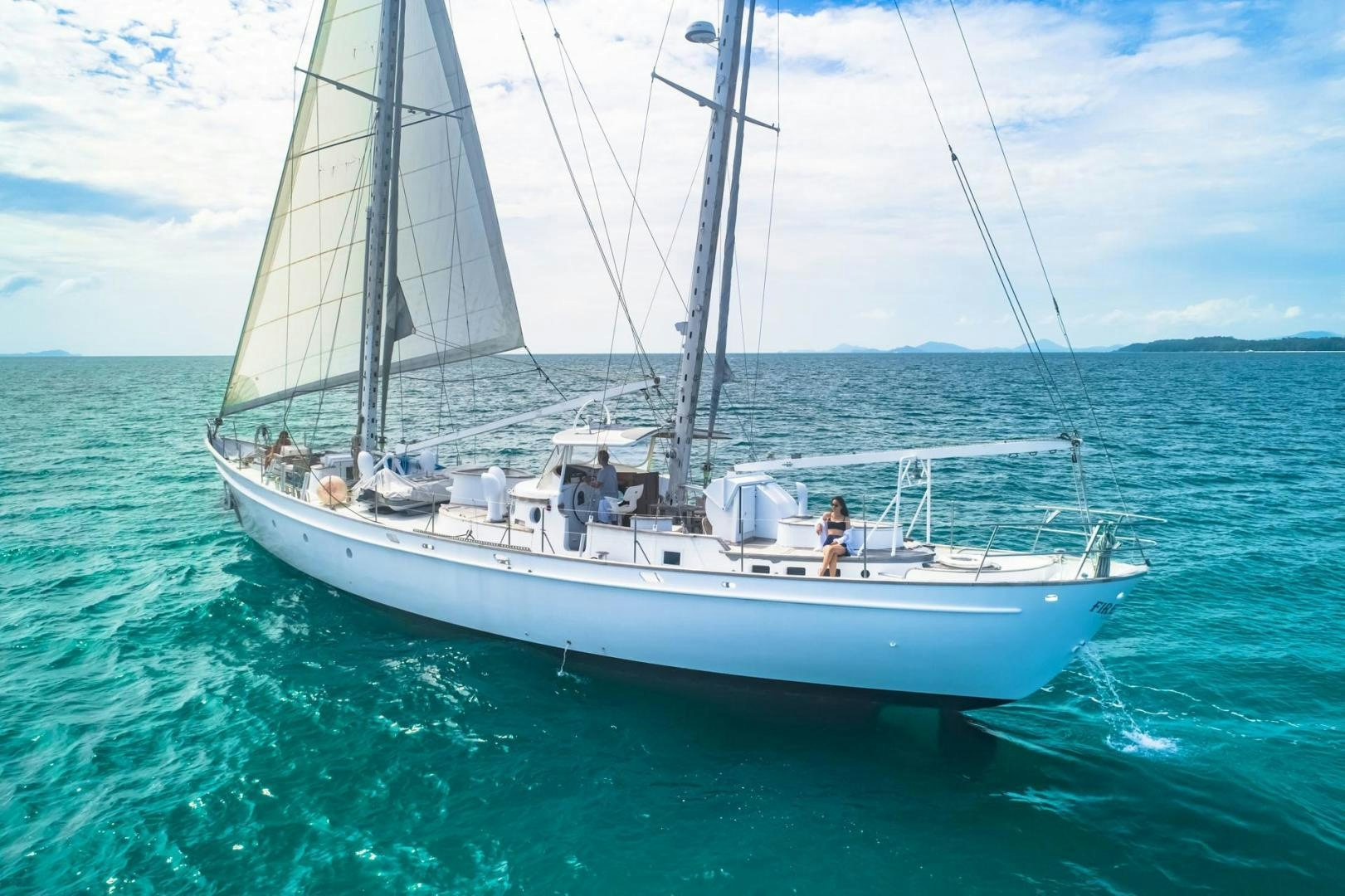 a boat sailing on the sea aboard FIREBIRD Yacht for Sale