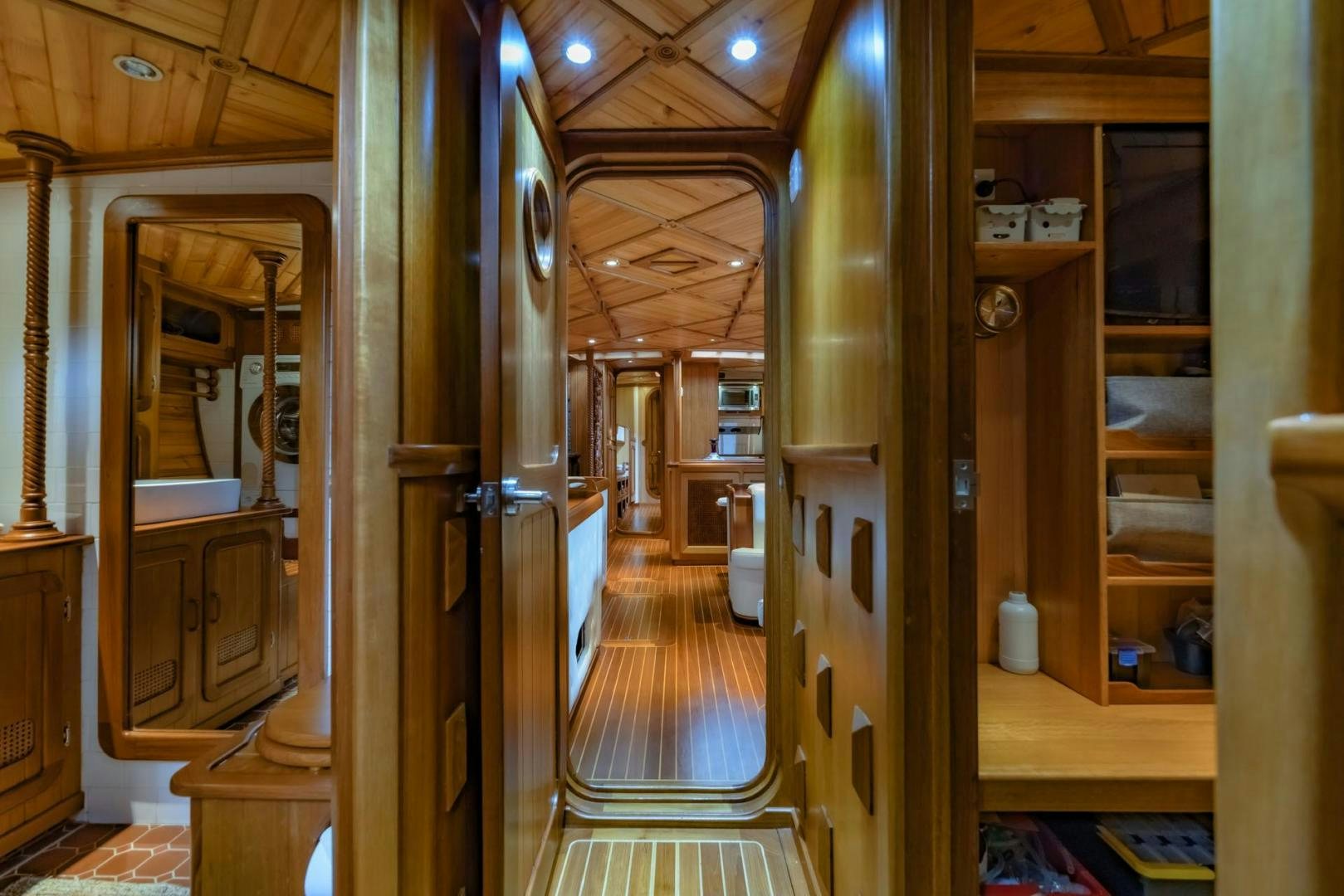a hallway with a wood door and a wood door aboard FIREBIRD Yacht for Sale