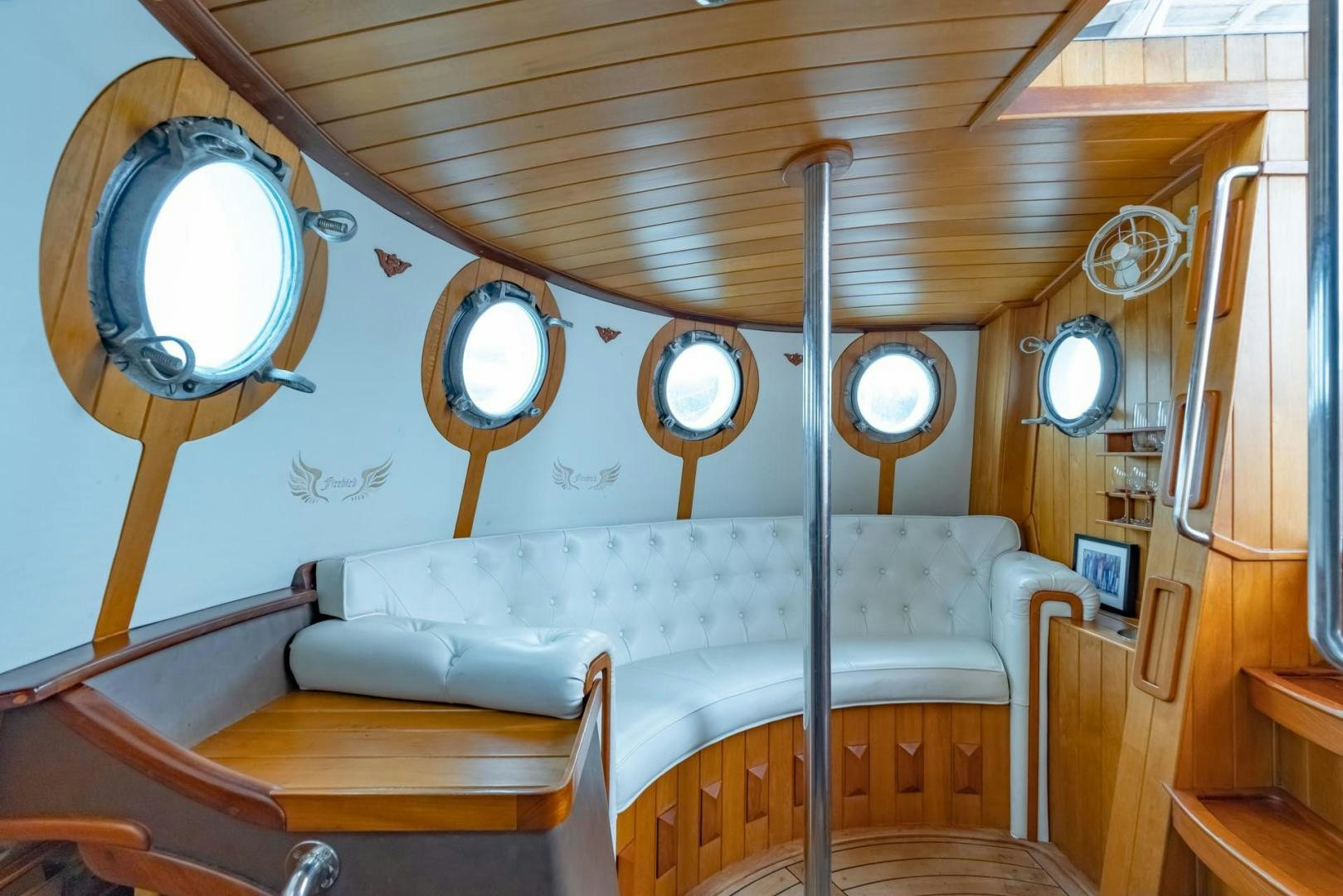 a room with a bed and a mirror aboard FIREBIRD Yacht for Sale