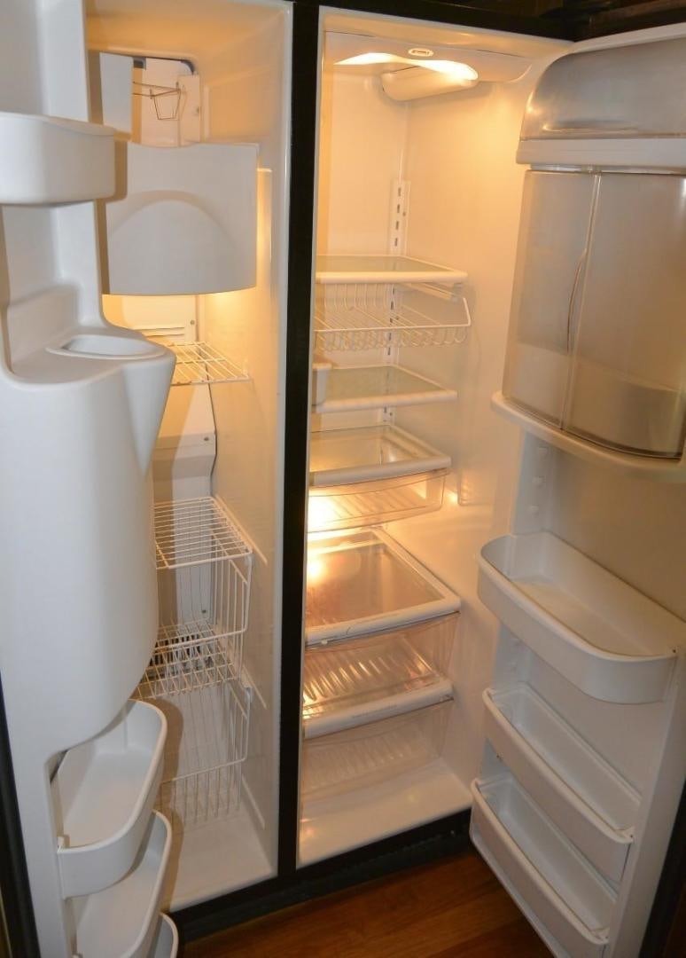 a white cabinet with shelves aboard DOG HOUSE Yacht for Sale