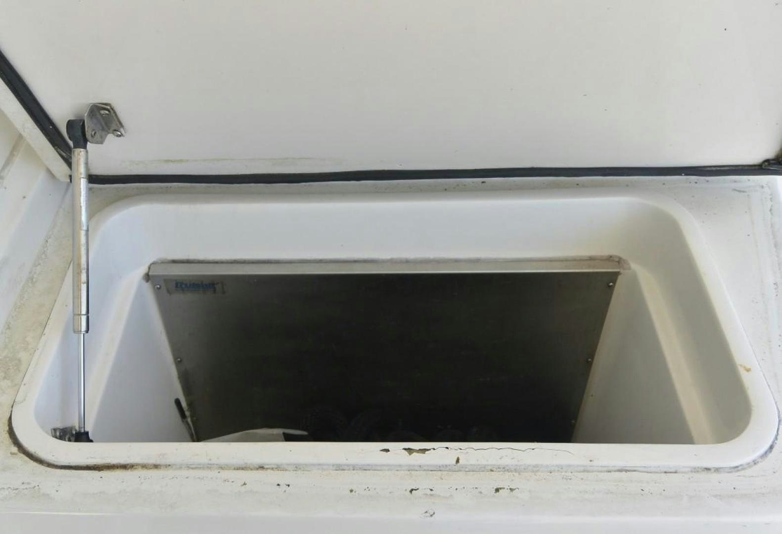 a white rectangular object with a black handle aboard DOG HOUSE Yacht for Sale