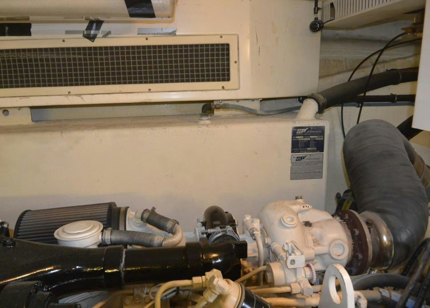 a car engine with a hood aboard DOG HOUSE Yacht for Sale