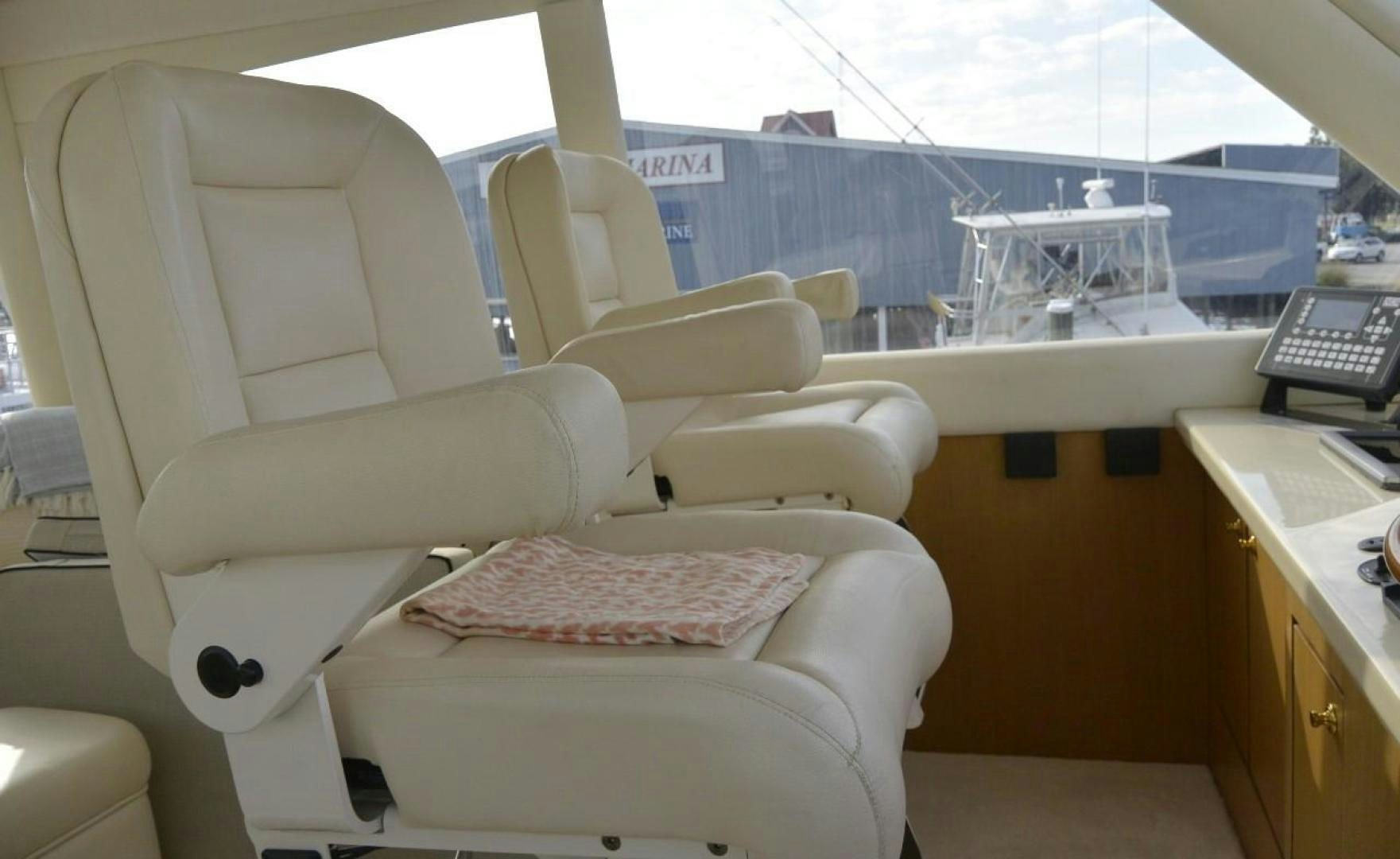 a white couch in a room aboard DOG HOUSE Yacht for Sale