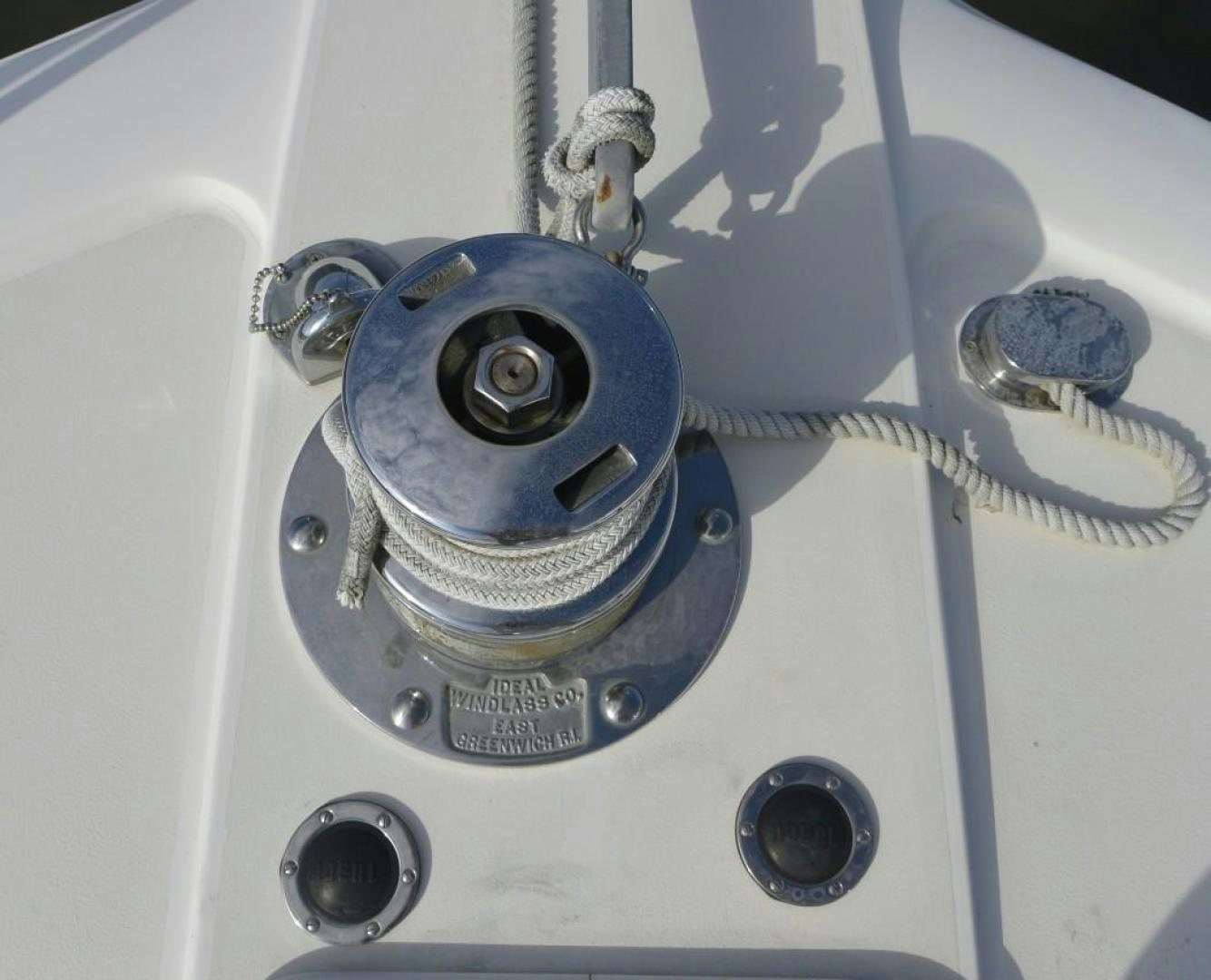 a white car with a blue gas pump aboard DOG HOUSE Yacht for Sale
