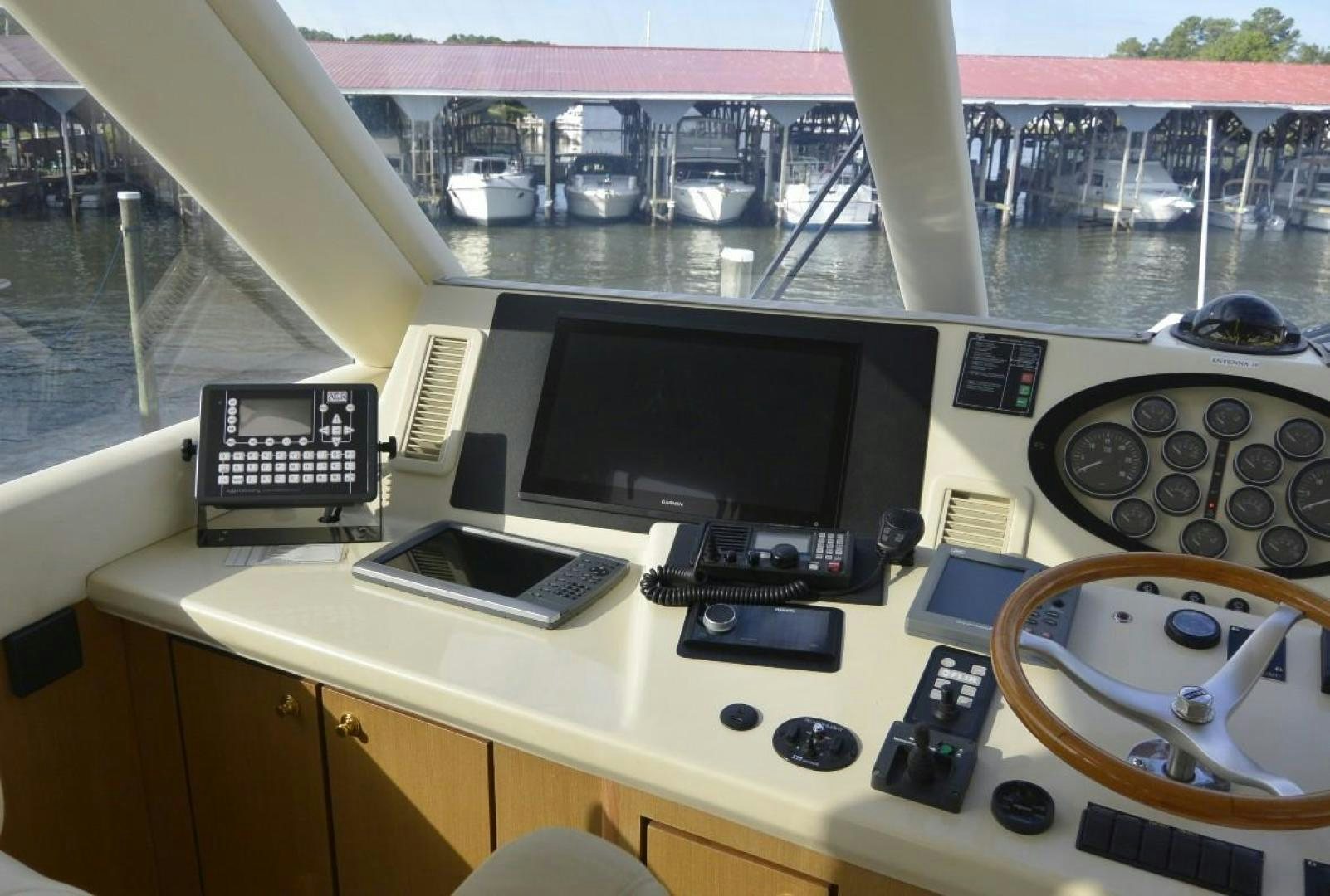 a desk with a computer and other electronics on it aboard DOG HOUSE Yacht for Sale