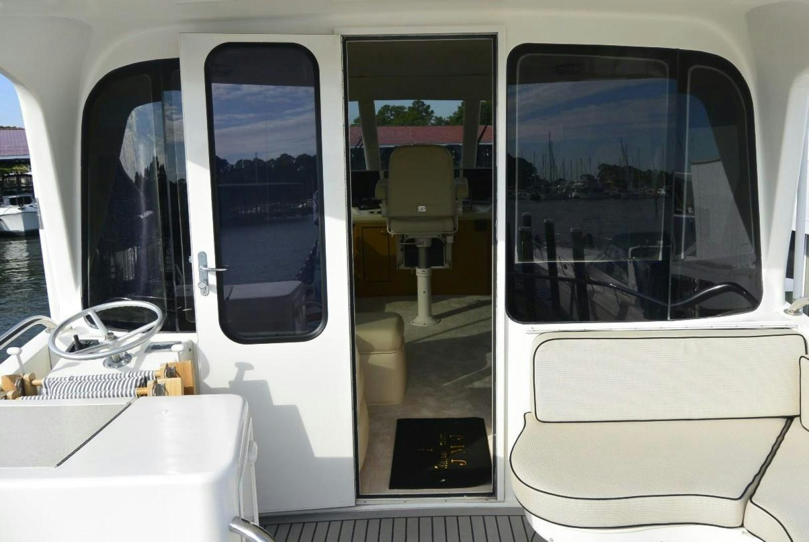 a couple of windows with doors open aboard DOG HOUSE Yacht for Sale