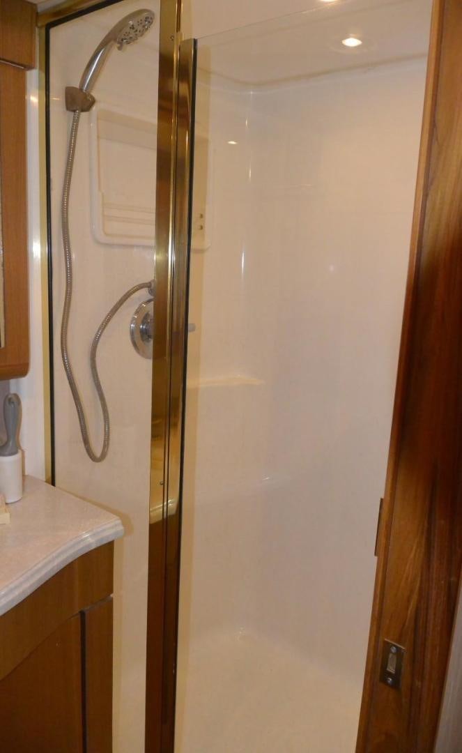 a shower unit with a glass door aboard DOG HOUSE Yacht for Sale