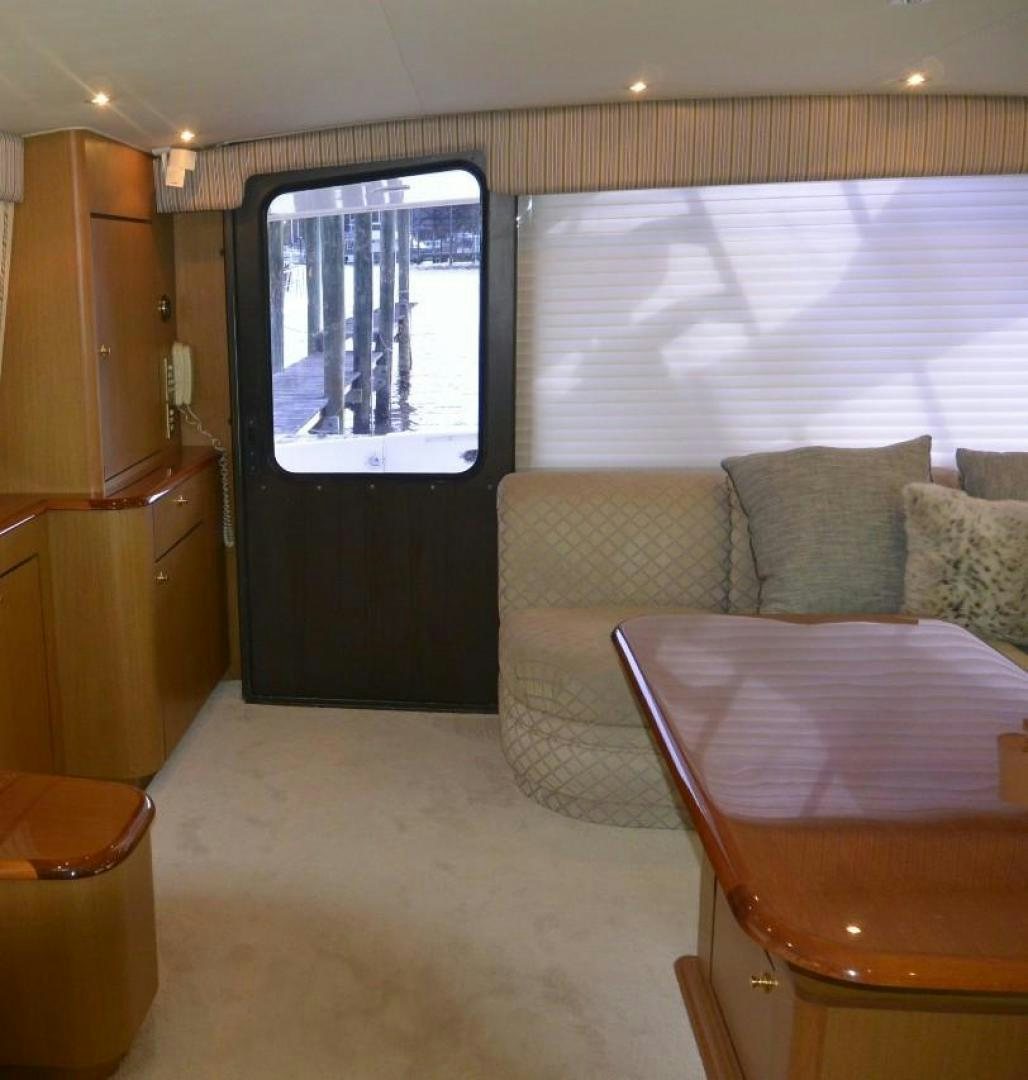 a living room with a couch and a table aboard DOG HOUSE Yacht for Sale