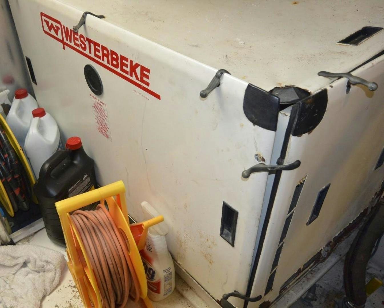 a white wall with a white wall and a red sign aboard DOG HOUSE Yacht for Sale