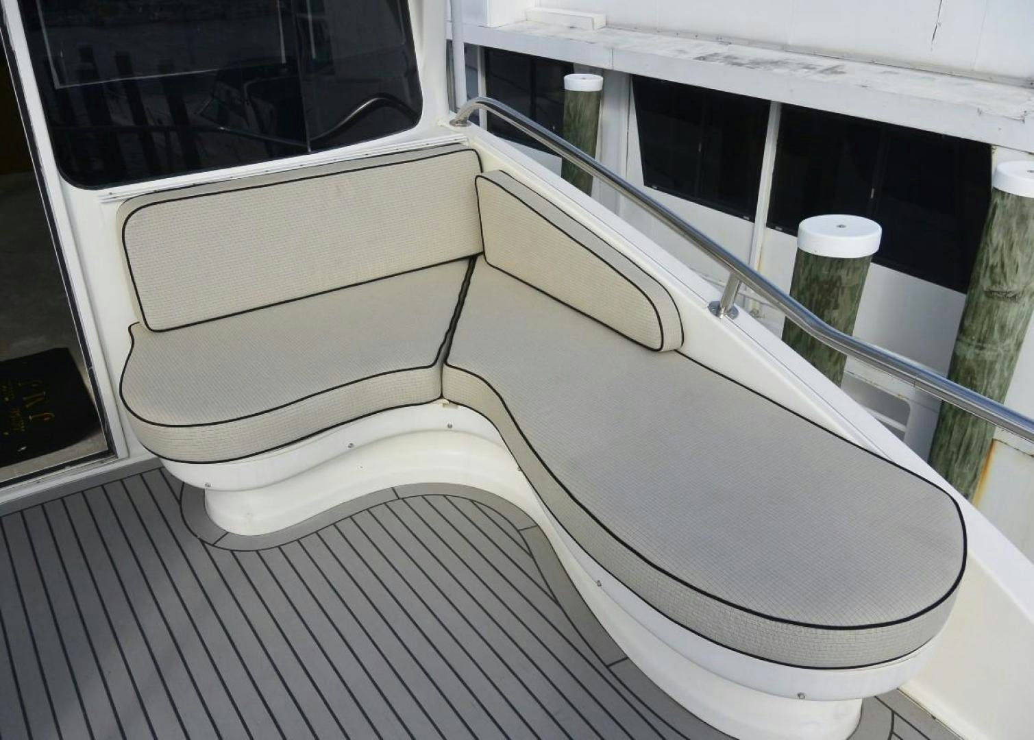 a white car with a white seat aboard DOG HOUSE Yacht for Sale