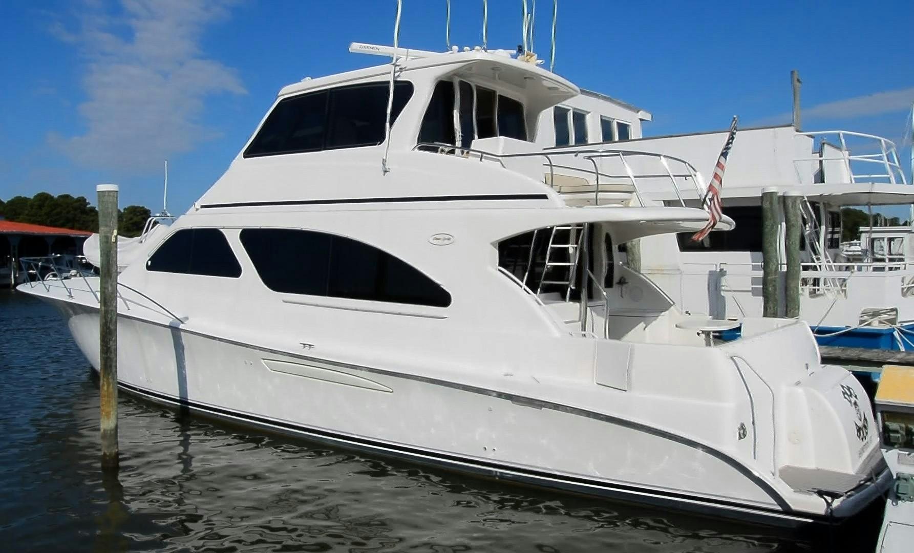 a white yacht docked aboard DOG HOUSE Yacht for Sale