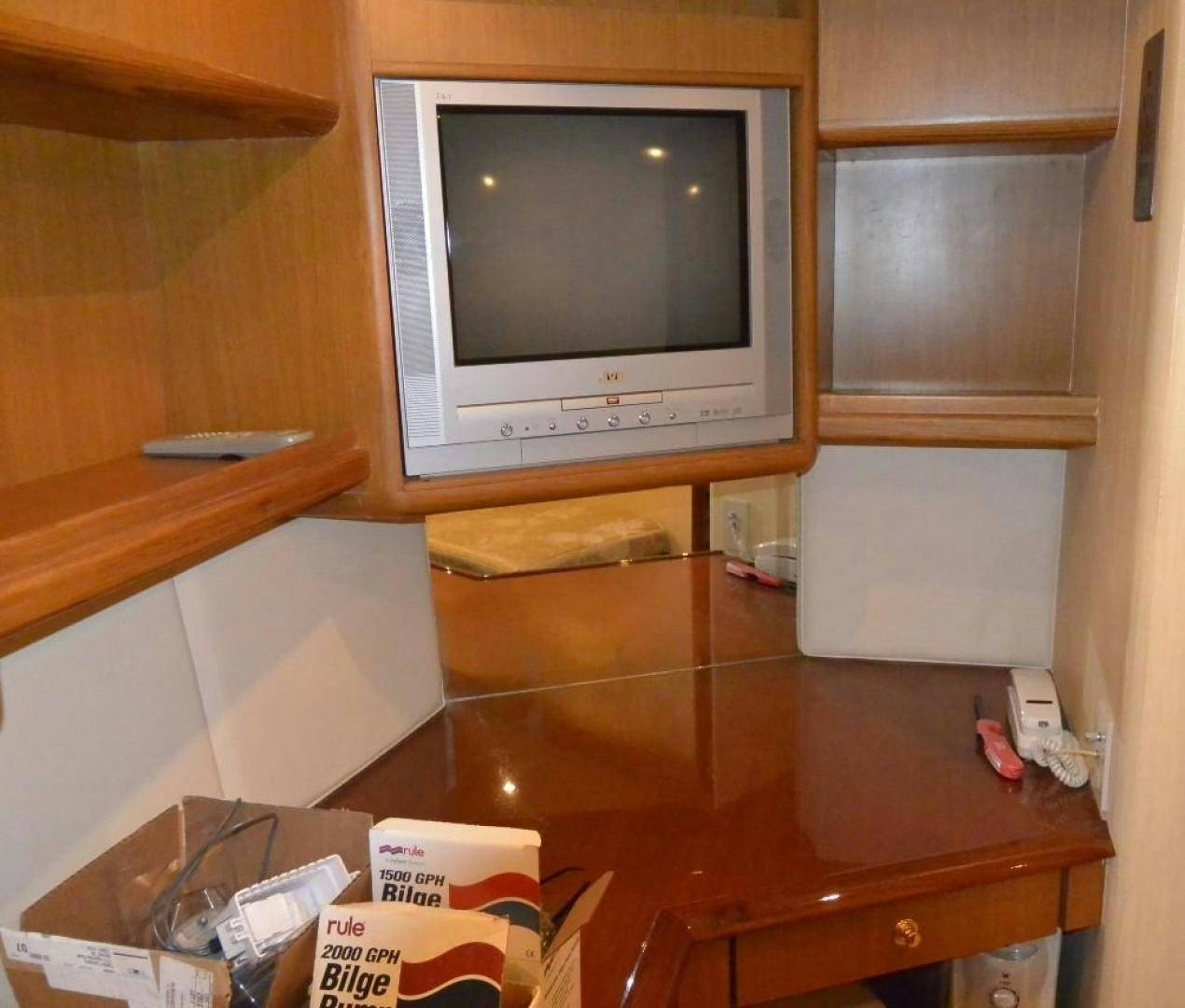 a tv on a shelf aboard DOG HOUSE Yacht for Sale