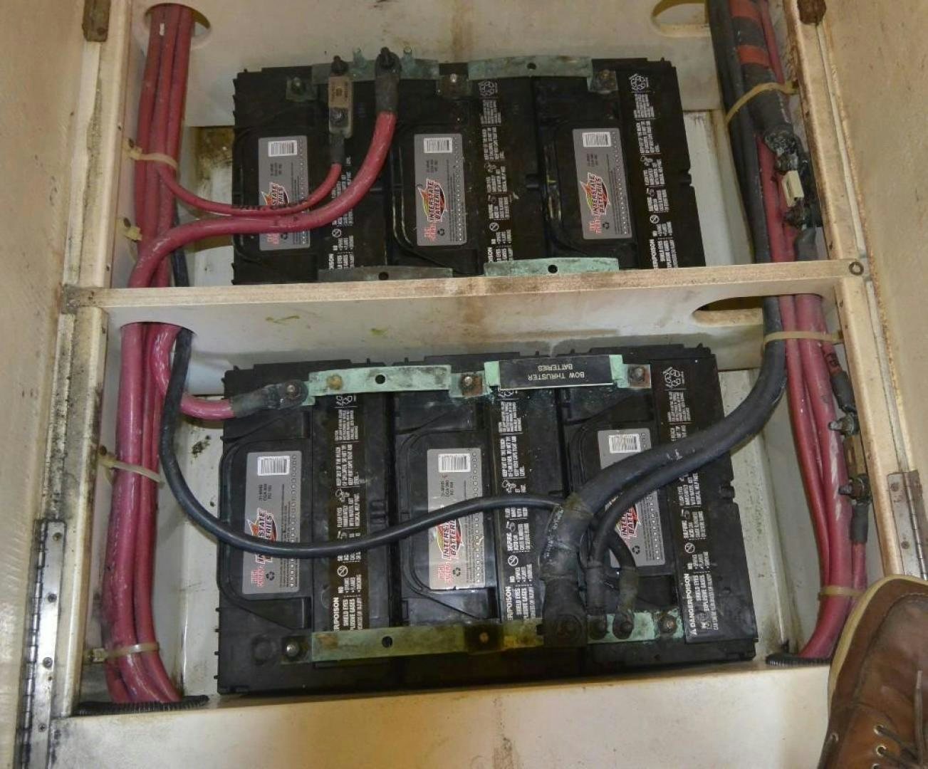 a shelf with a variety of electronics aboard DOG HOUSE Yacht for Sale