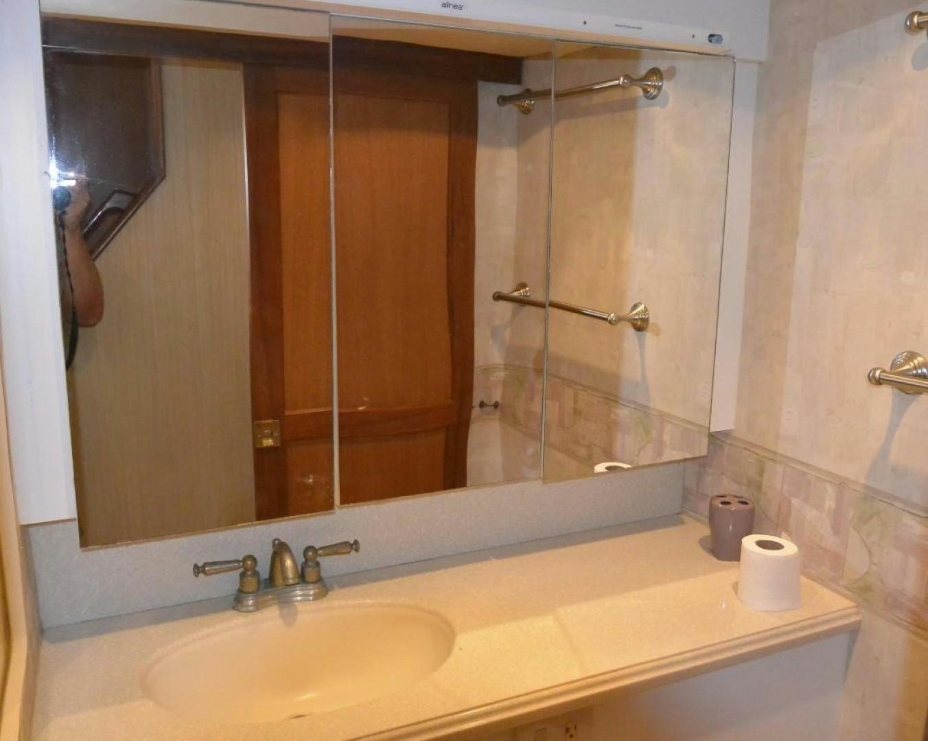 a bathroom with a large mirror aboard DOG HOUSE Yacht for Sale