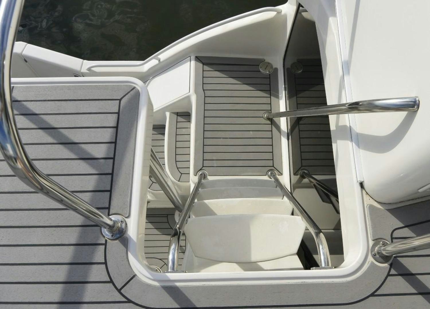 a white boat with a metal frame aboard DOG HOUSE Yacht for Sale