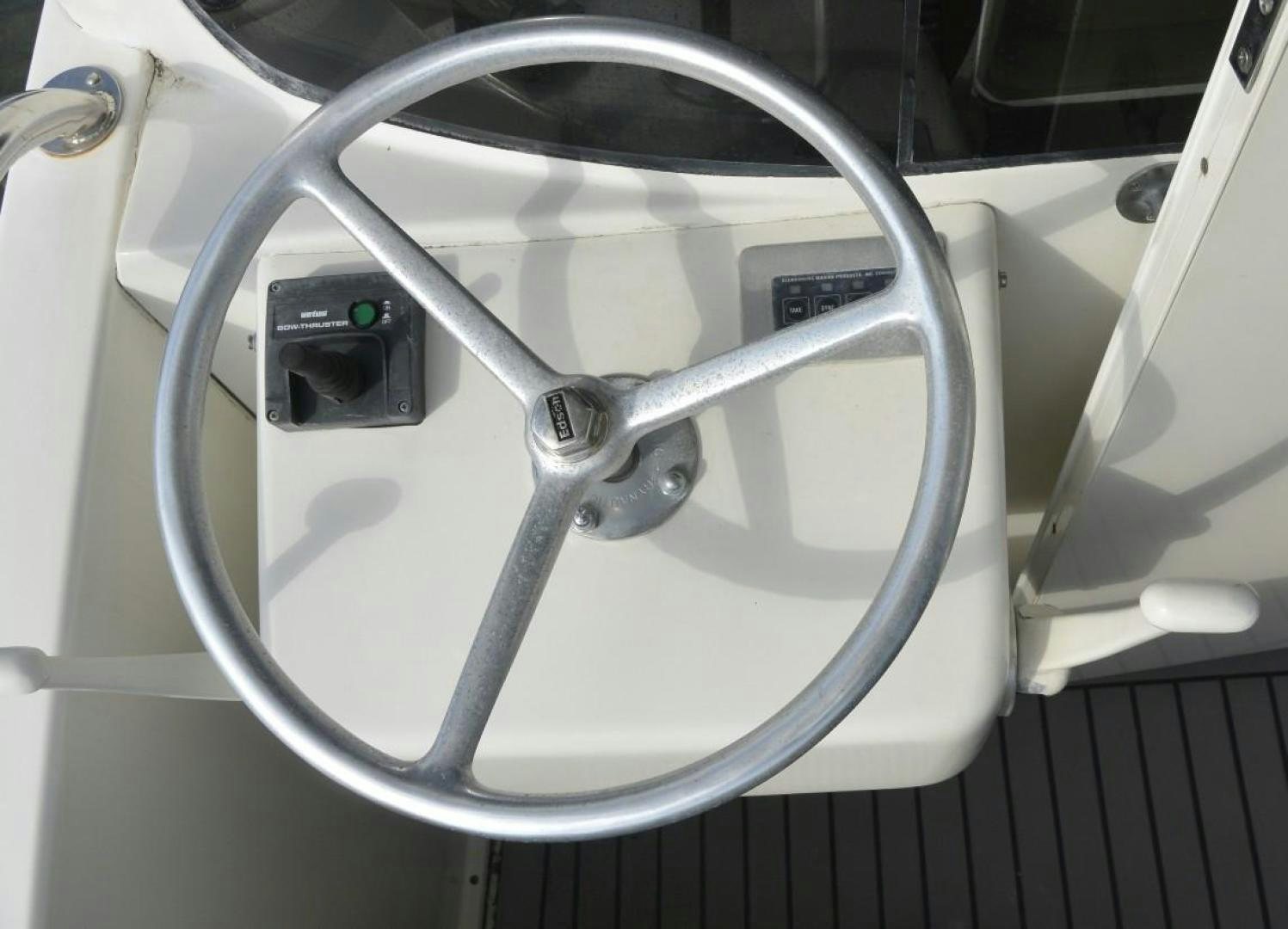 a close-up of a steering wheel aboard DOG HOUSE Yacht for Sale
