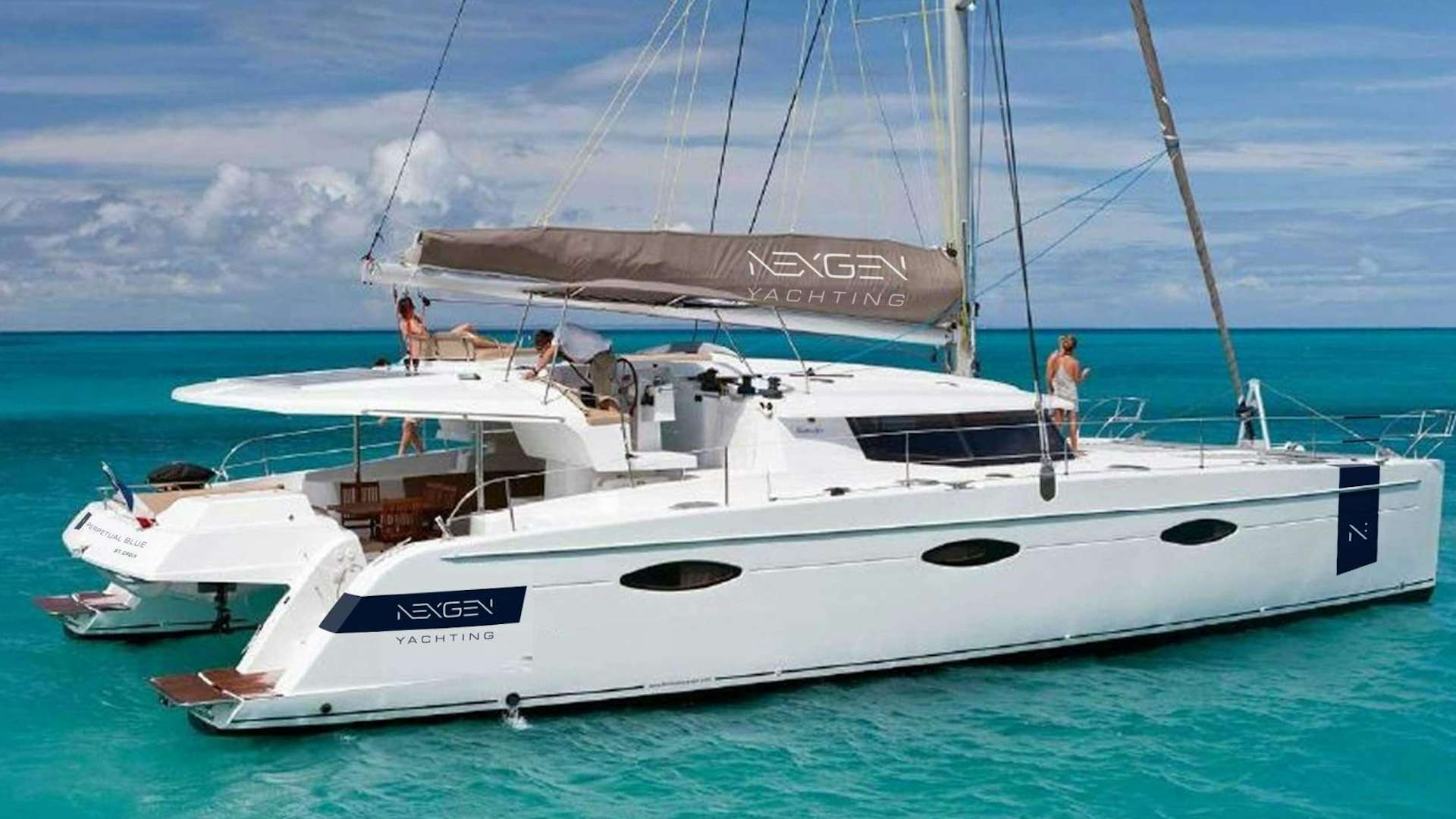 a boat with a couple people on it aboard Perpetual Blue Yacht for Sale
