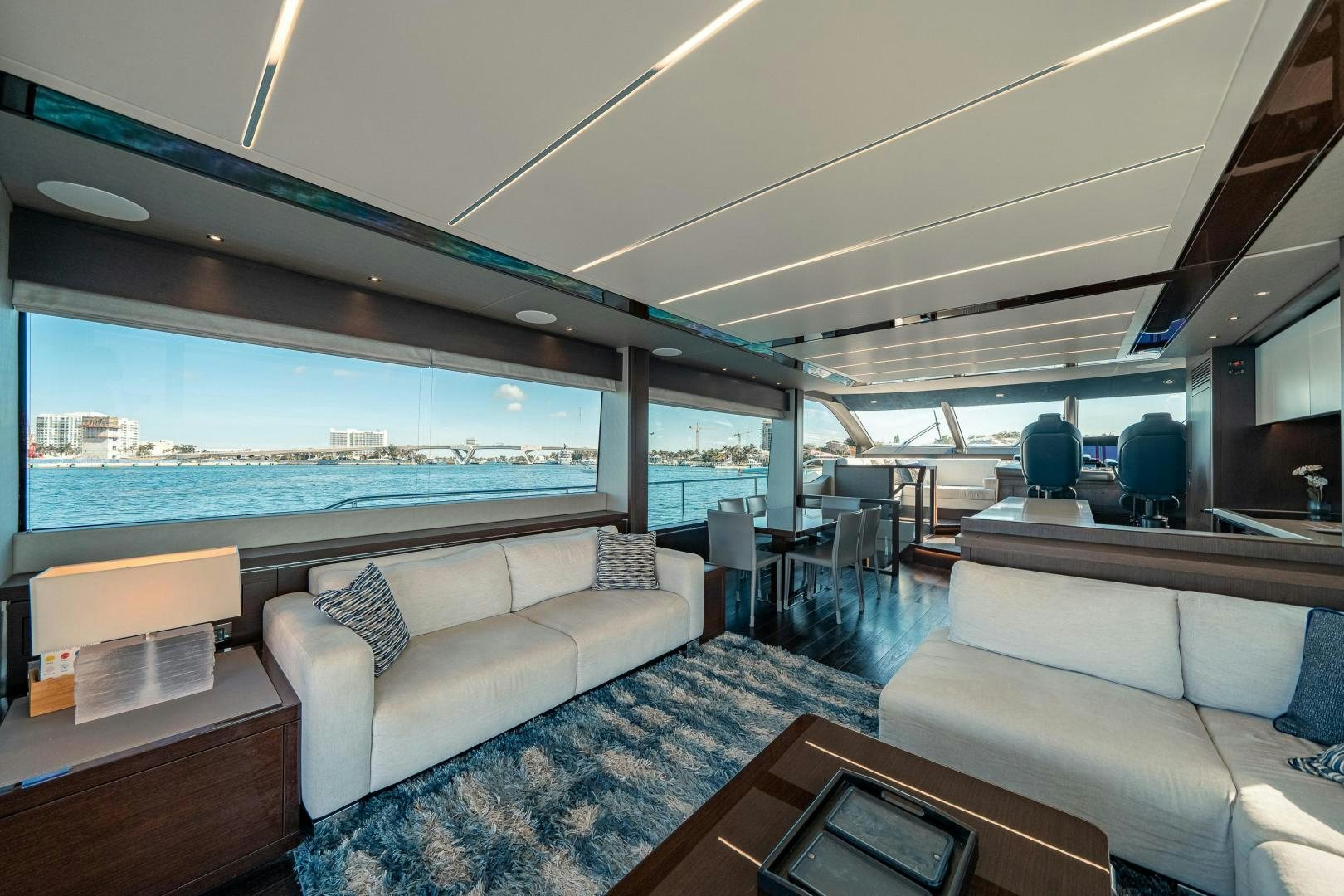 a living room with a large window aboard Life for Sale Yacht for Sale