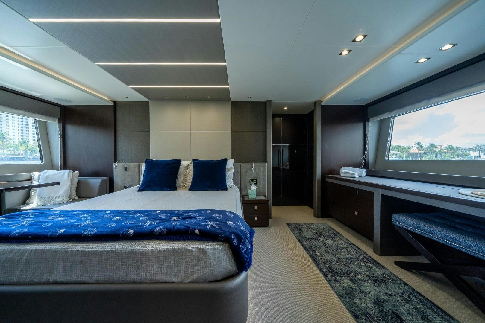a room with a bed and a desk aboard Life for Sale Yacht for Sale