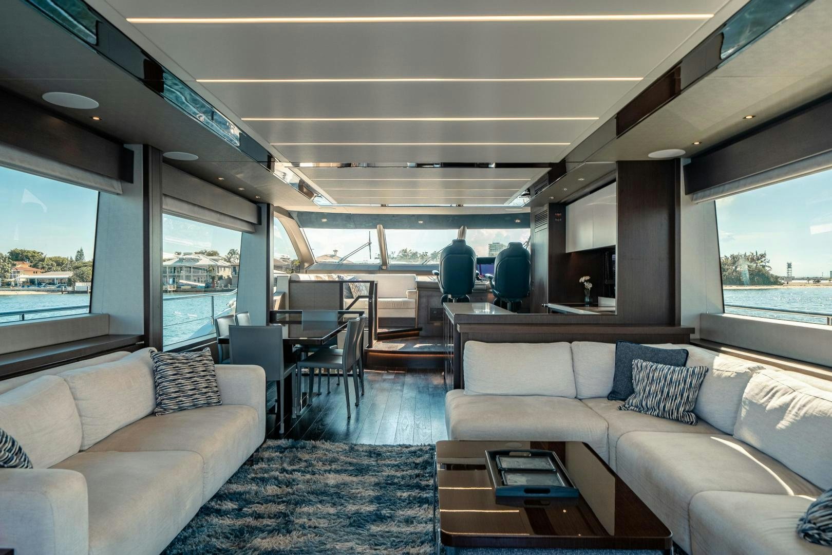 a train car with a couch and a table aboard Life for Sale Yacht for Sale