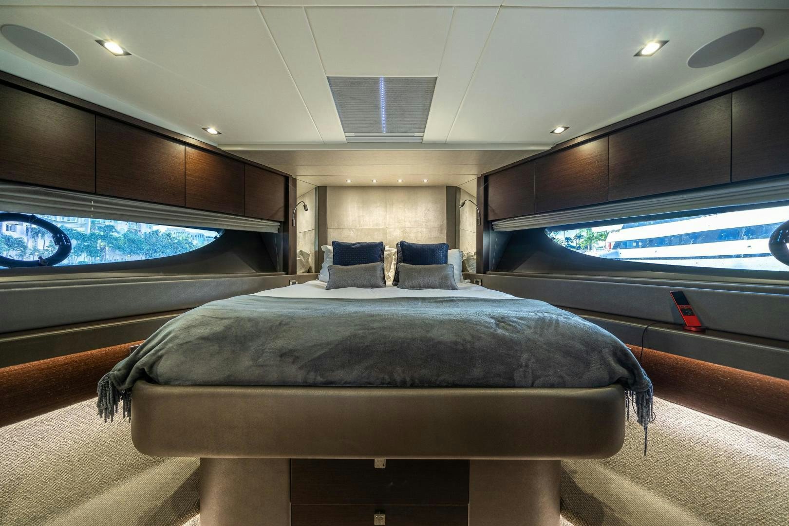 a room with a bed and a window aboard Life for Sale Yacht for Sale
