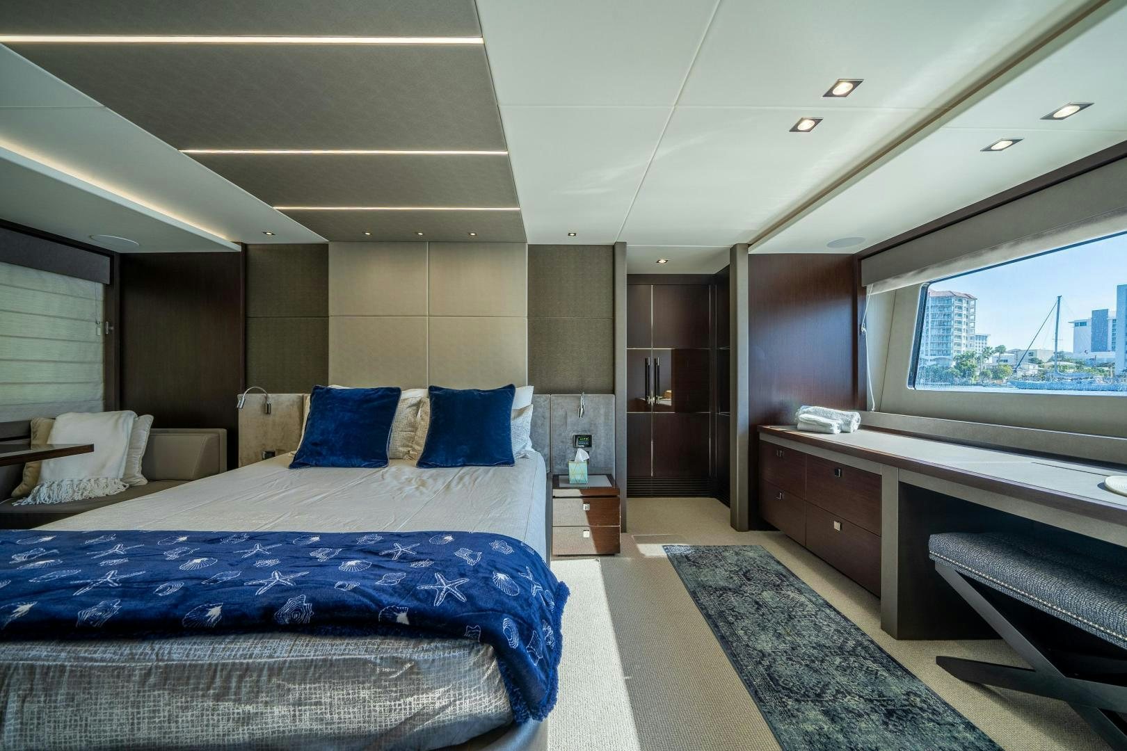 a room with a bed and a tv aboard Life for Sale Yacht for Sale