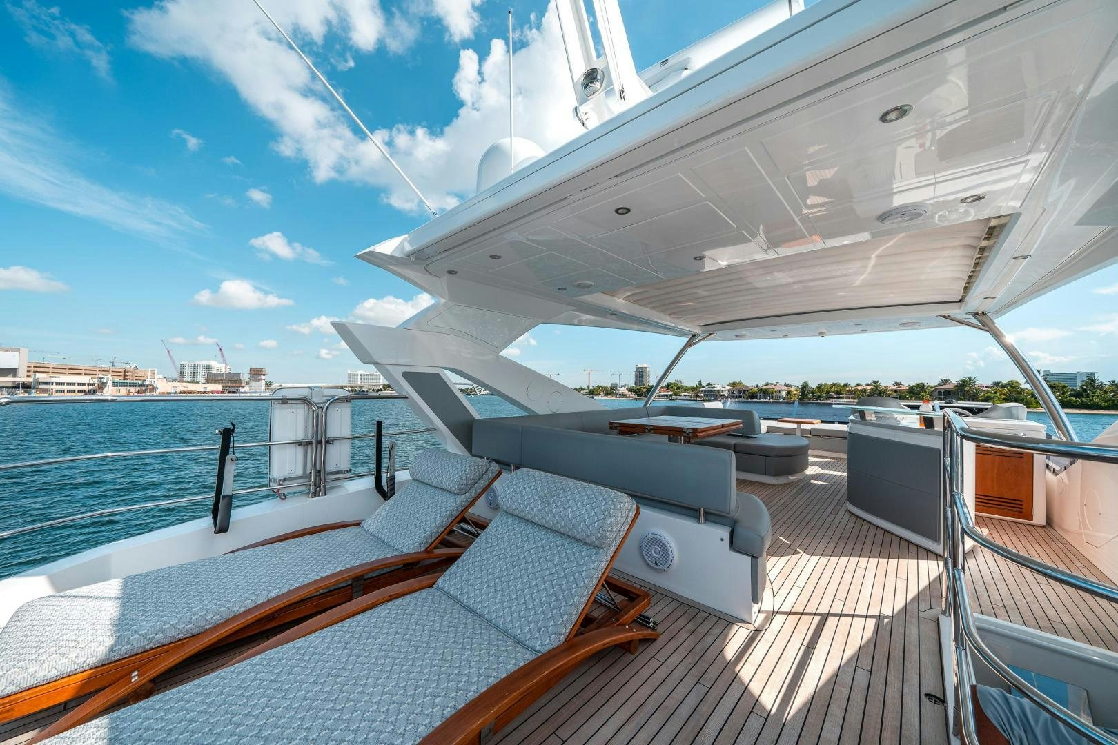 a deck with a large deck overlooking a large body of water aboard Life for Sale Yacht for Sale