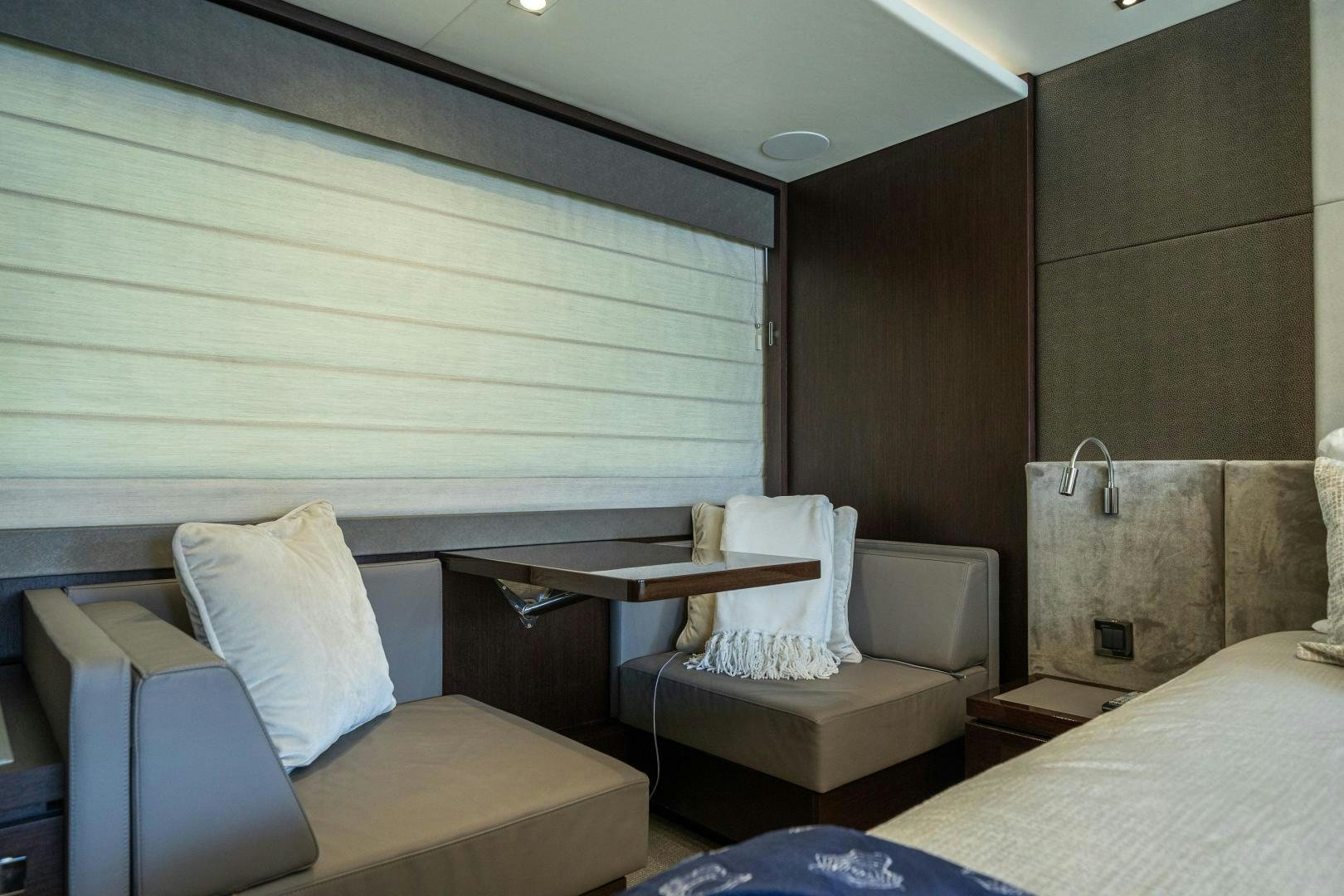 a room with a bed and a chair aboard Life for Sale Yacht for Sale