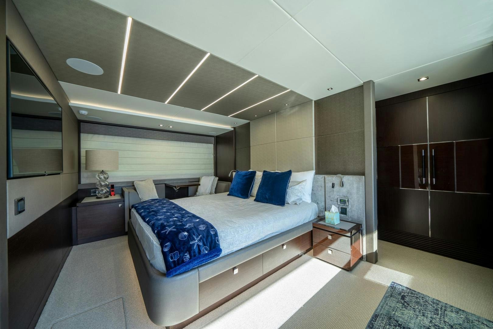 a room with a bed and a mirror aboard Life for Sale Yacht for Sale