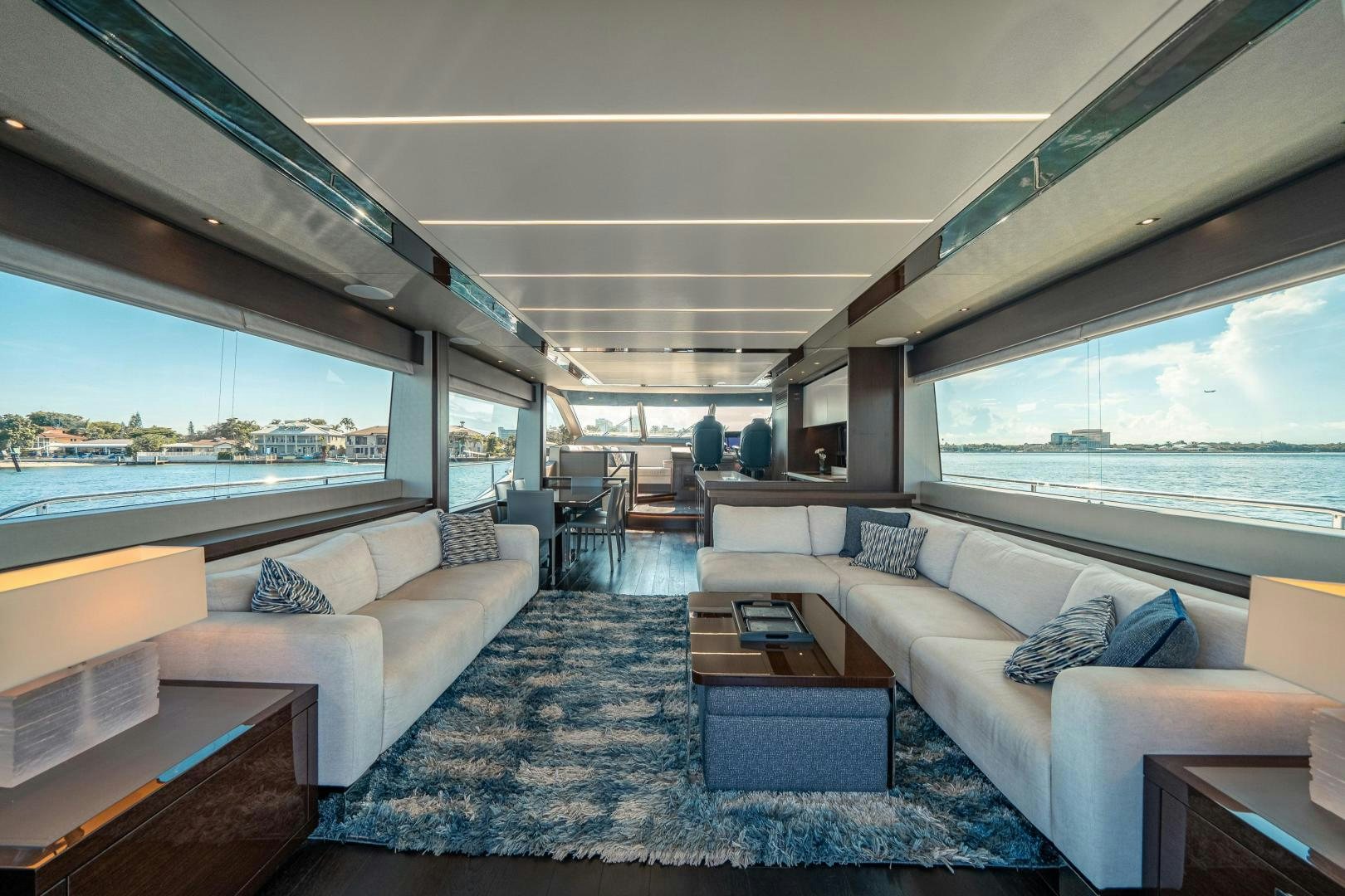 a living room with a large window aboard Life for Sale Yacht for Sale