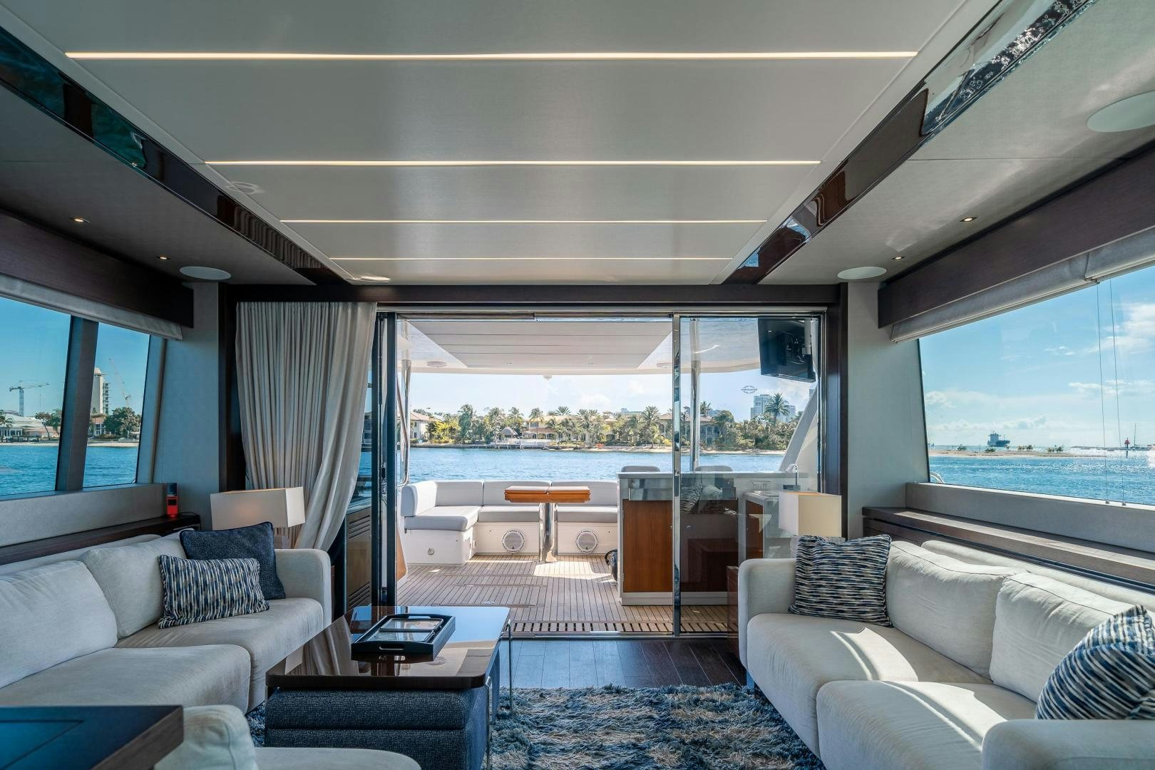 a living room with a large window aboard Life for Sale Yacht for Sale