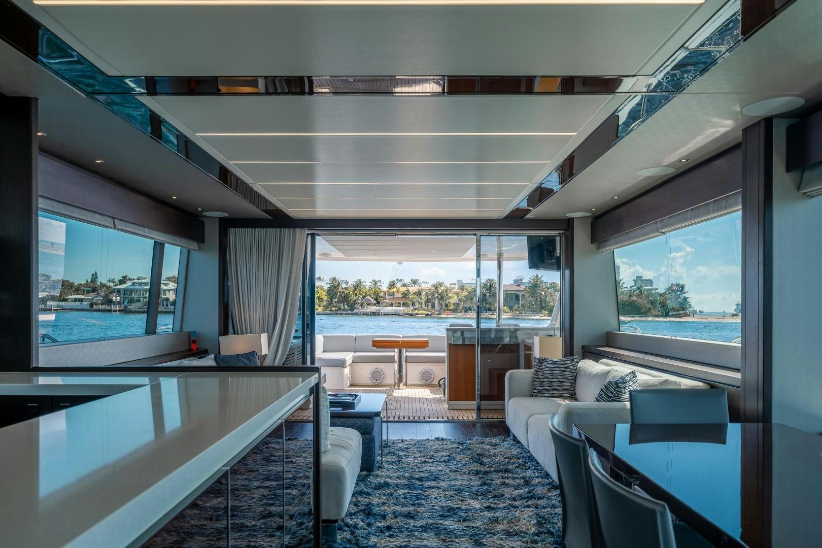 a room with a large window and a view of the city aboard Life for Sale Yacht for Sale