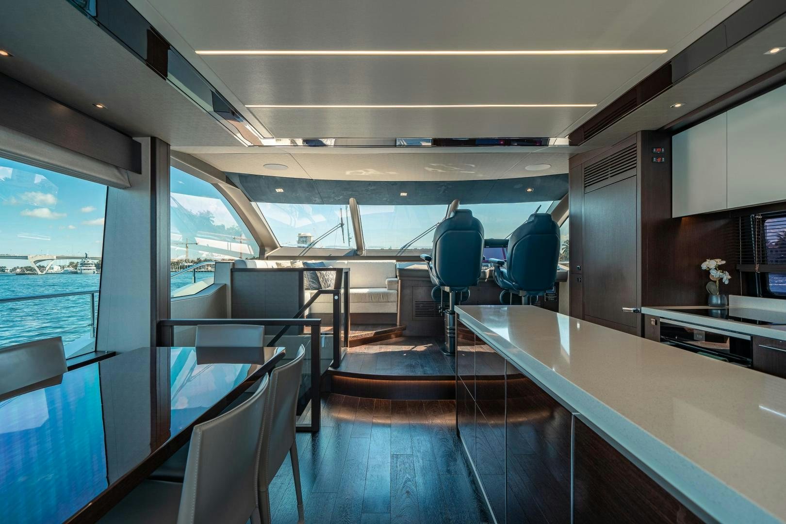 inside of a vehicle with a table and chairs and a window aboard Life for Sale Yacht for Sale
