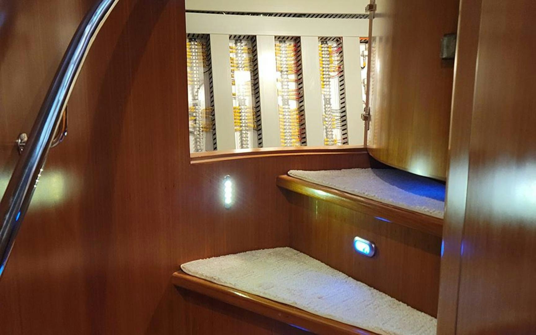 a wooden cabinet with a light aboard GOWIN PLACES IV Yacht for Sale