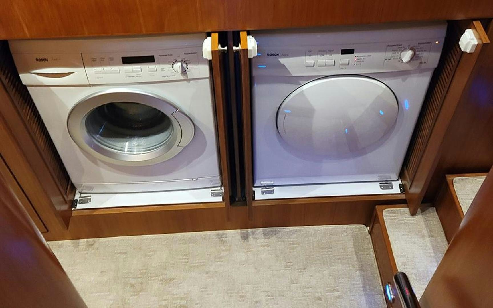 a washing machine and dryer in a room aboard GOWIN PLACES IV Yacht for Sale