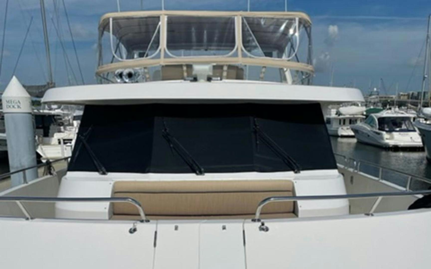 a white yacht in a harbor aboard GOWIN PLACES IV Yacht for Sale