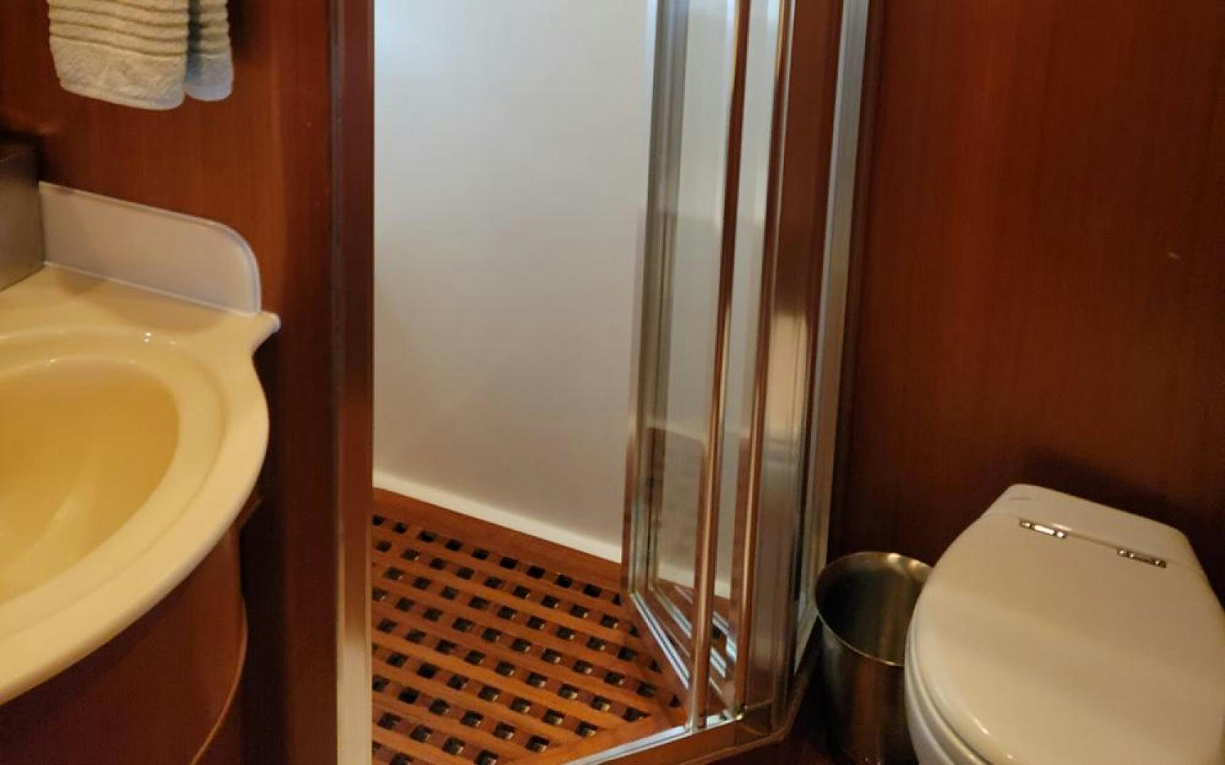 a bathroom with a glass shower aboard GOWIN PLACES IV Yacht for Sale