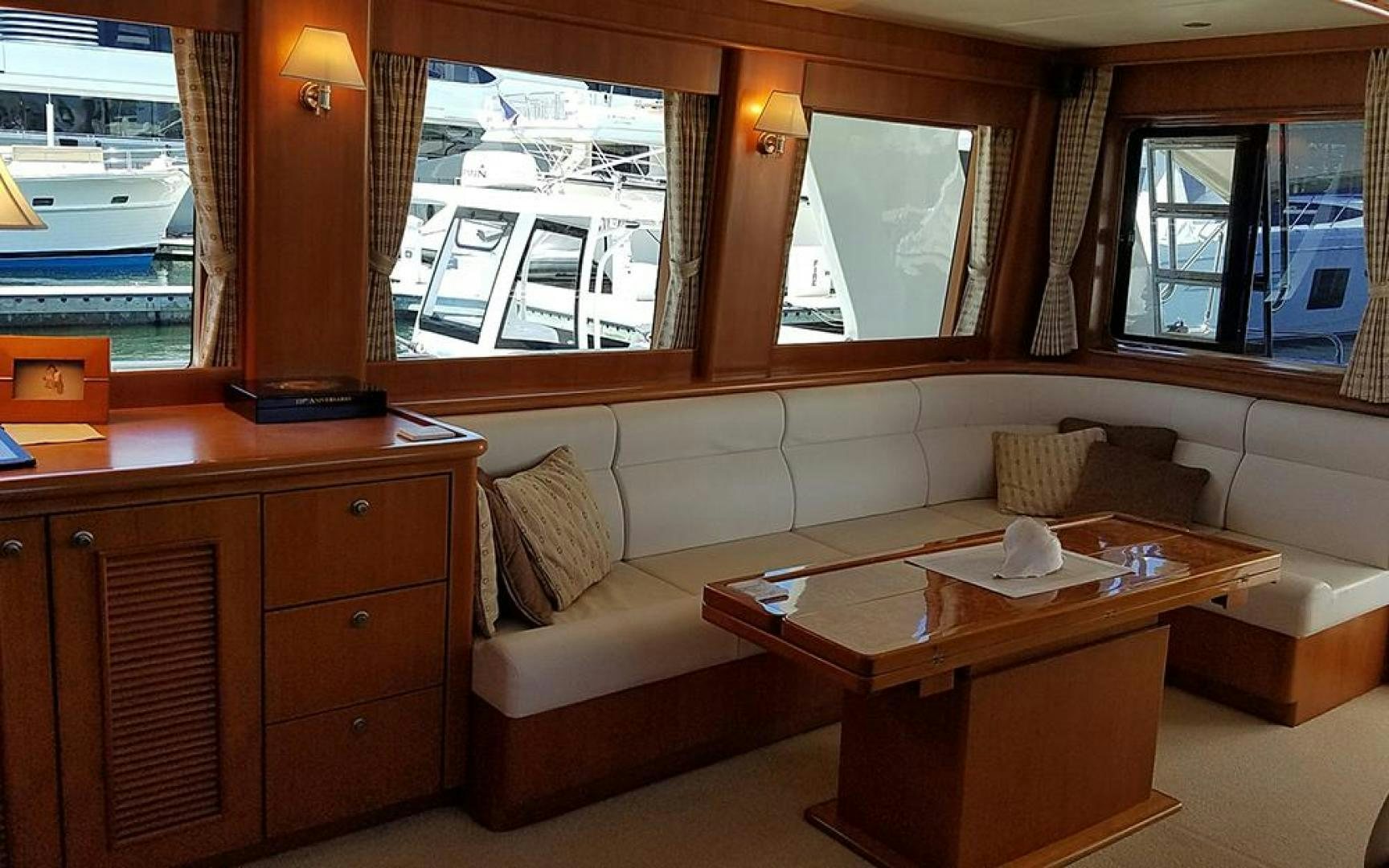 a living room with a couch and a coffee table aboard GOWIN PLACES IV Yacht for Sale