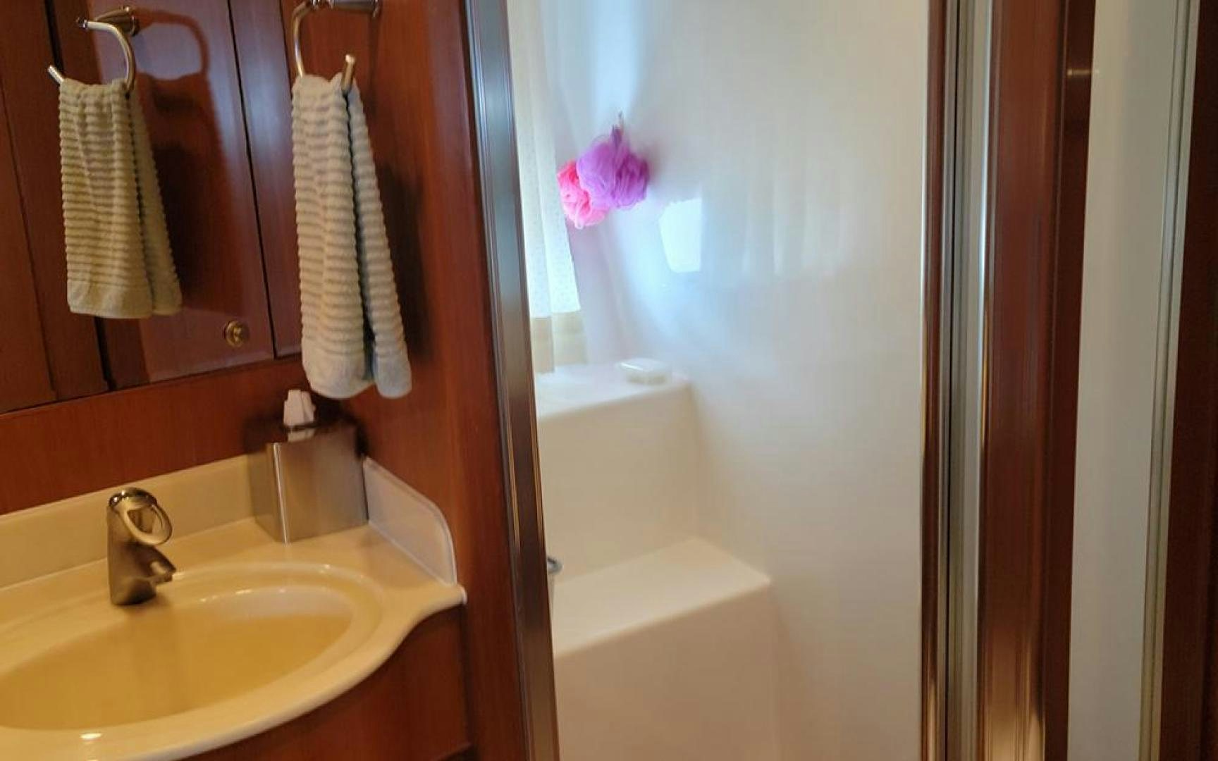 a bathroom with a sink and a bathtub aboard GOWIN PLACES IV Yacht for Sale