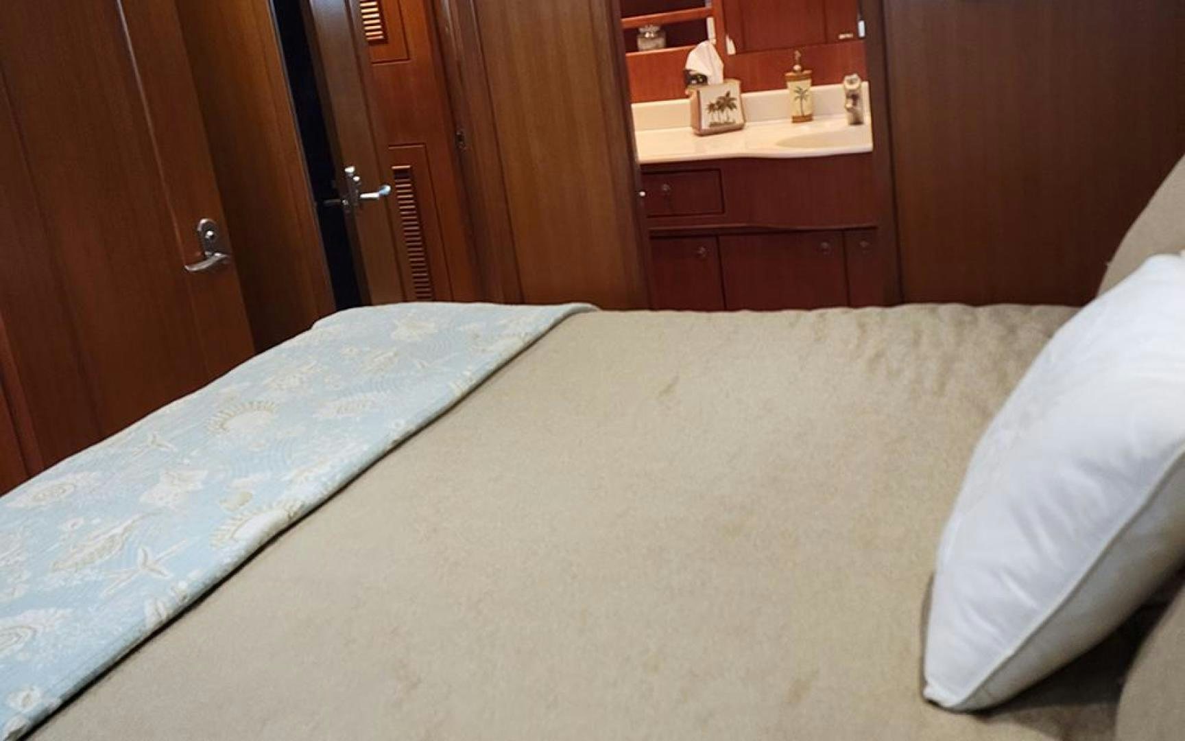 a bed with white sheets aboard GOWIN PLACES IV Yacht for Sale