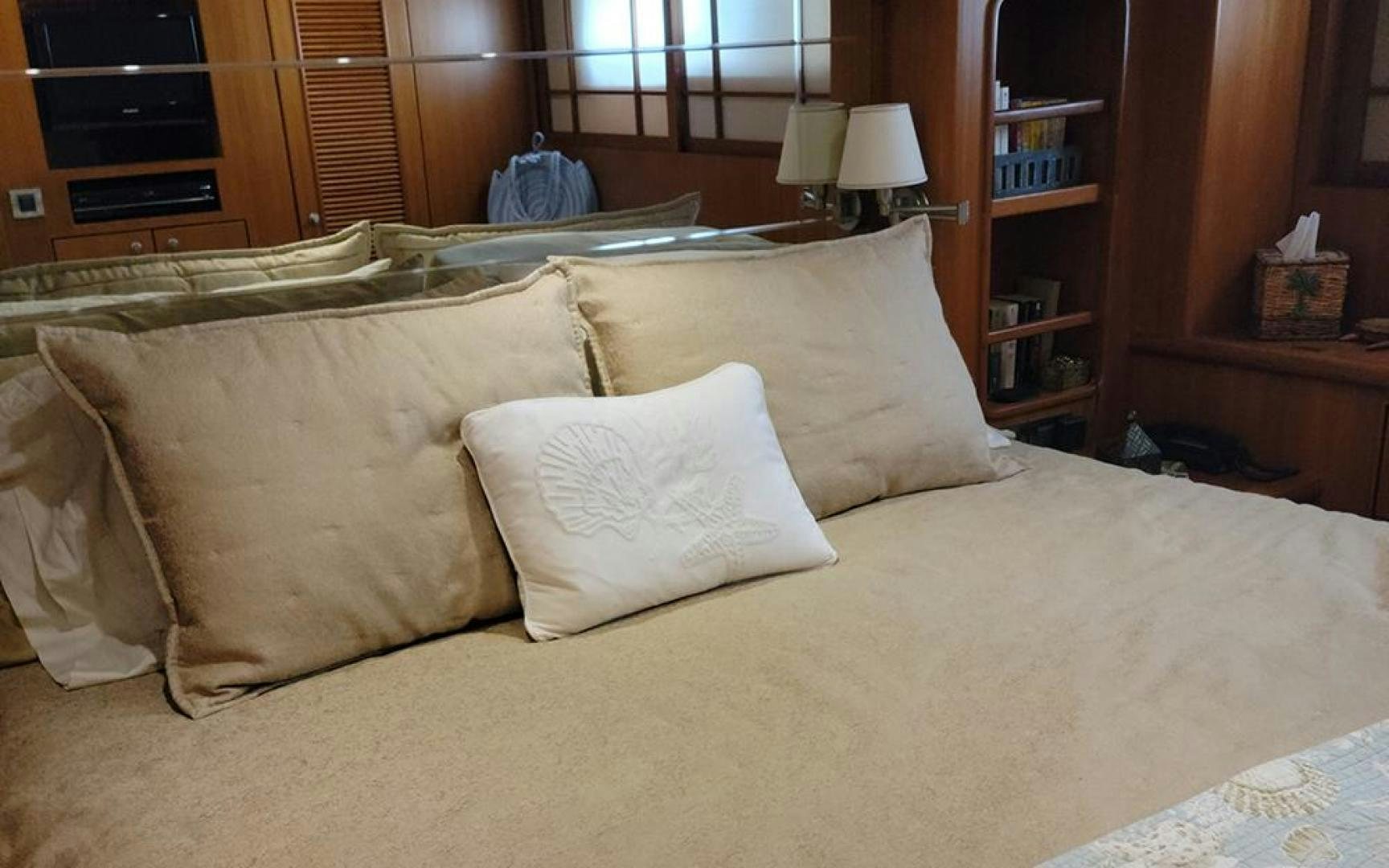 a bed with pillows aboard GOWIN PLACES IV Yacht for Sale