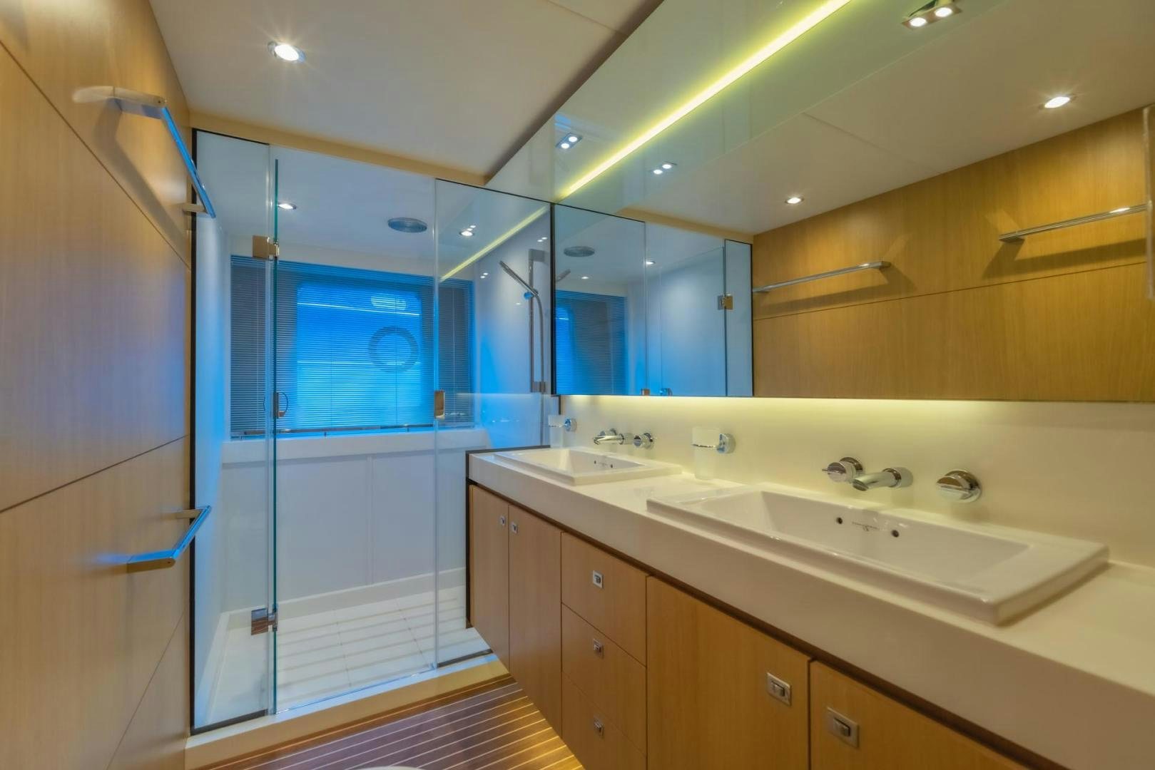 a bathroom with a large mirror aboard GIFZY Yacht for Sale