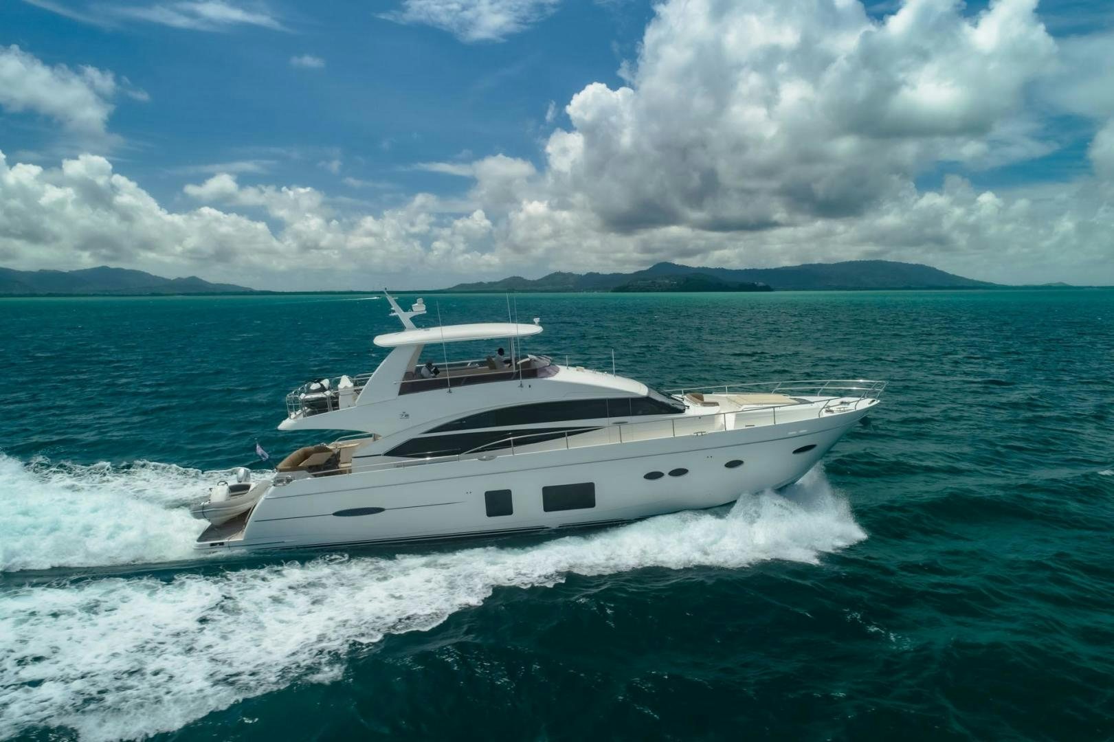 a white yacht on the water aboard GIFZY Yacht for Sale