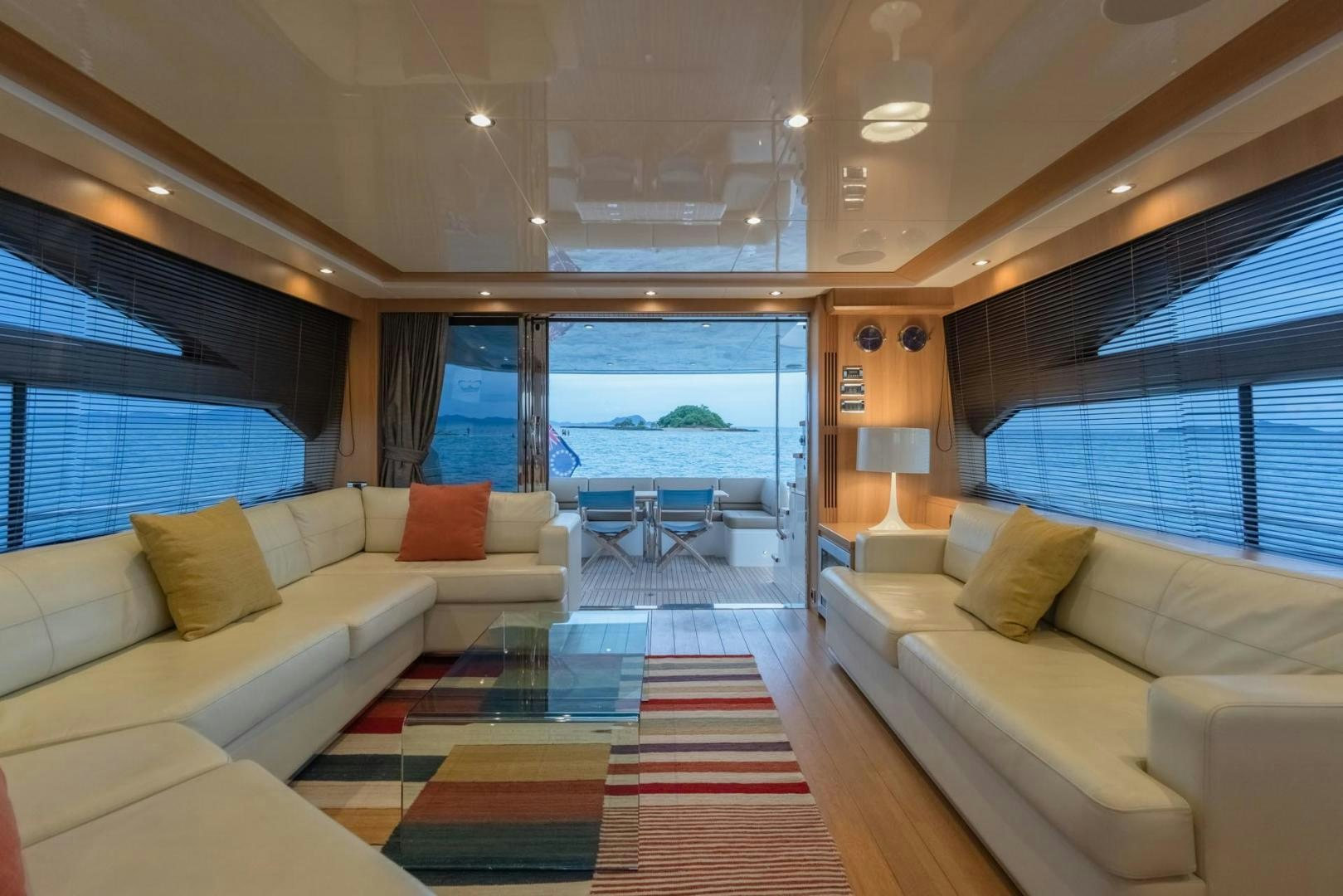 a living room with a large window aboard GIFZY Yacht for Sale