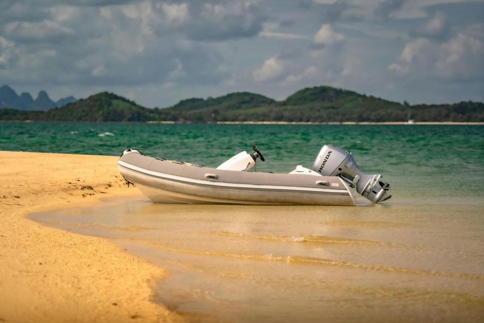 a boat on a beach aboard GIFZY Yacht for Sale