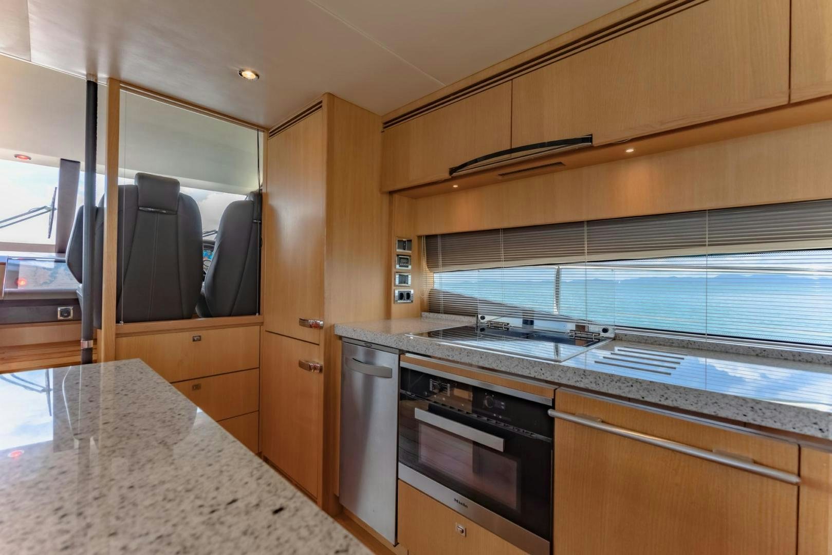 a kitchen with a large island aboard GIFZY Yacht for Sale